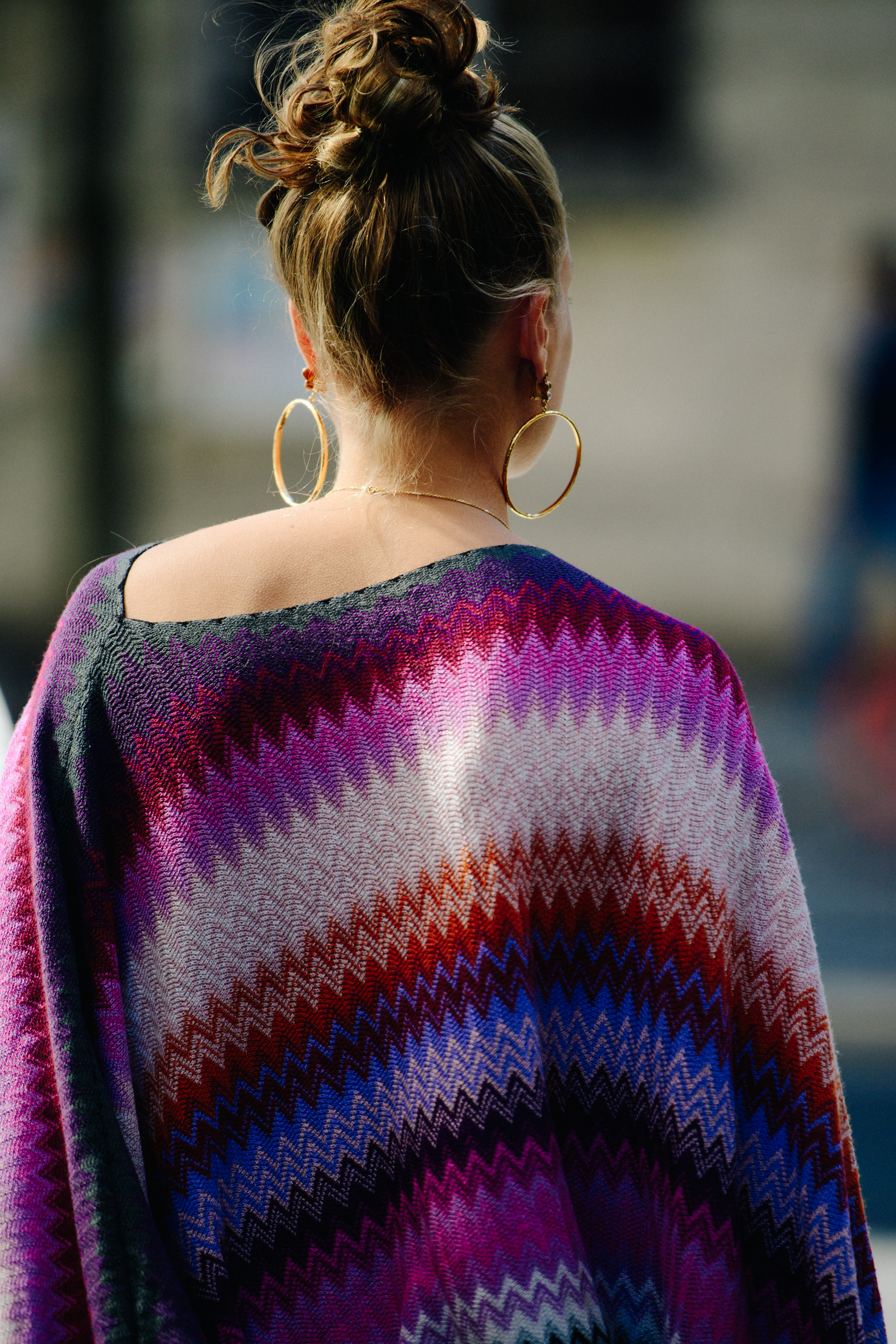 Woman wearing purple poncho