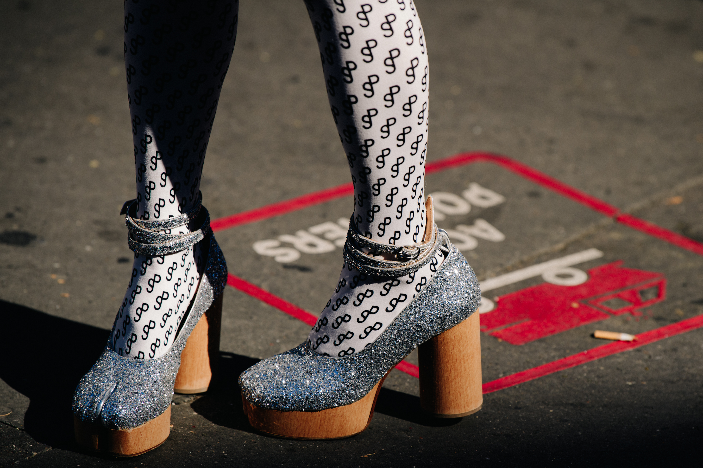 Woman wearing silver glitter heels