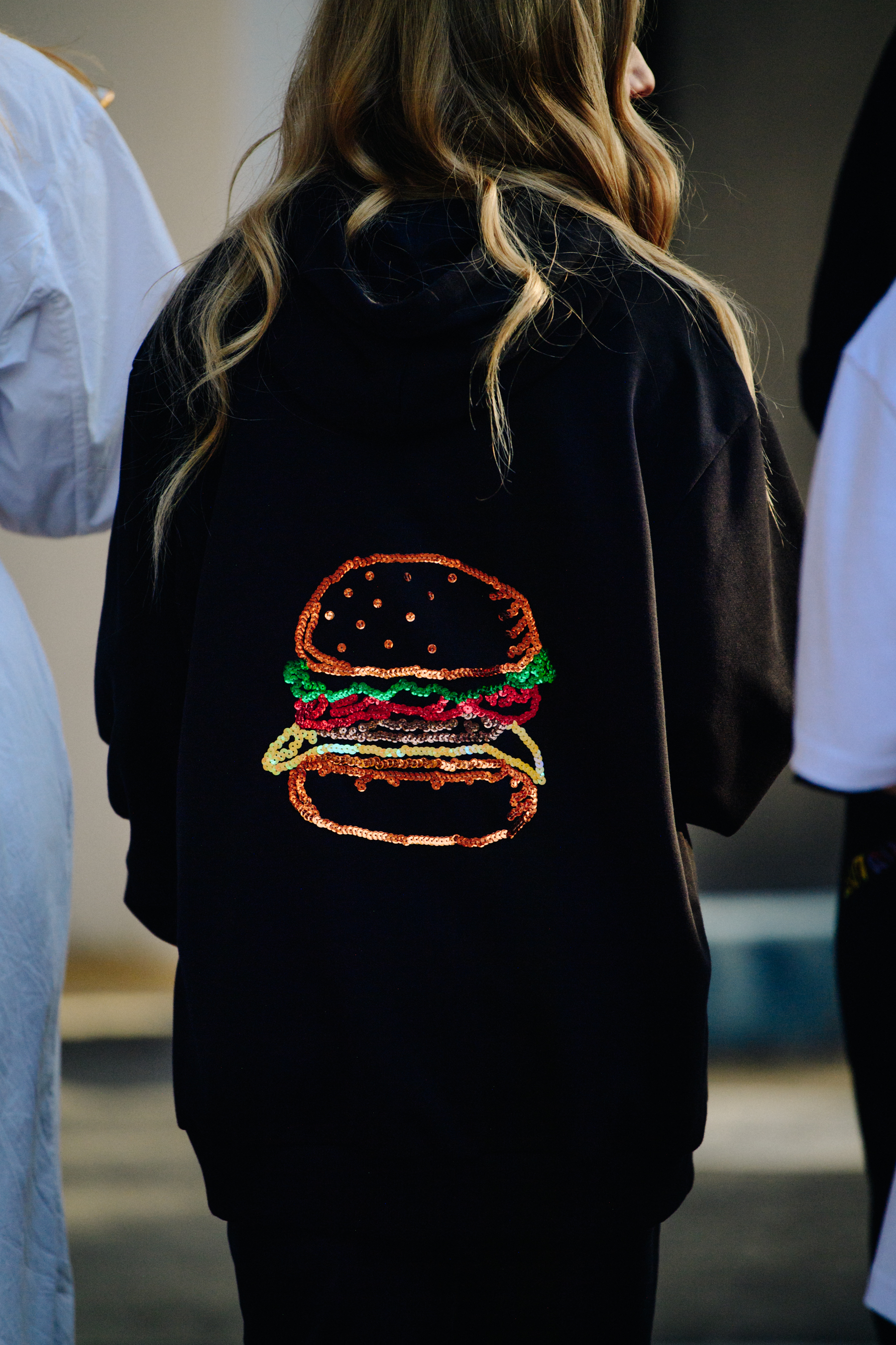 Woman wearing hamburger sequin top