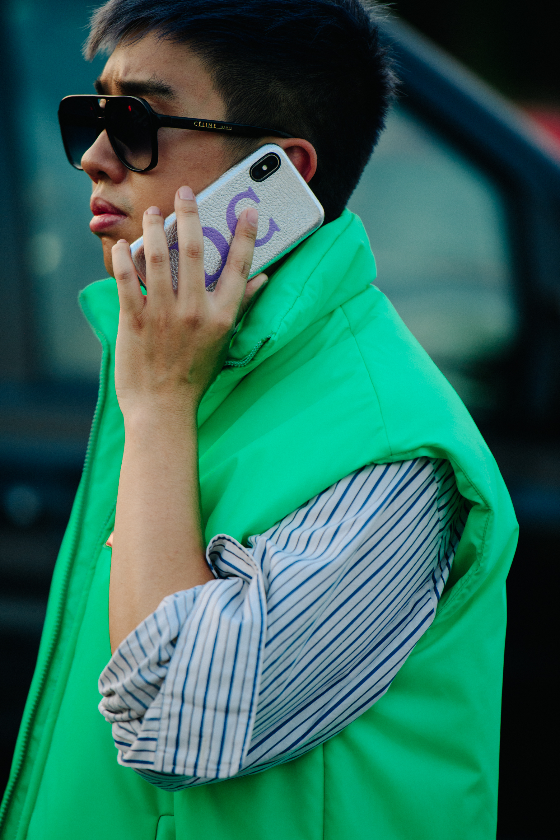 Man wearing green Prada vest