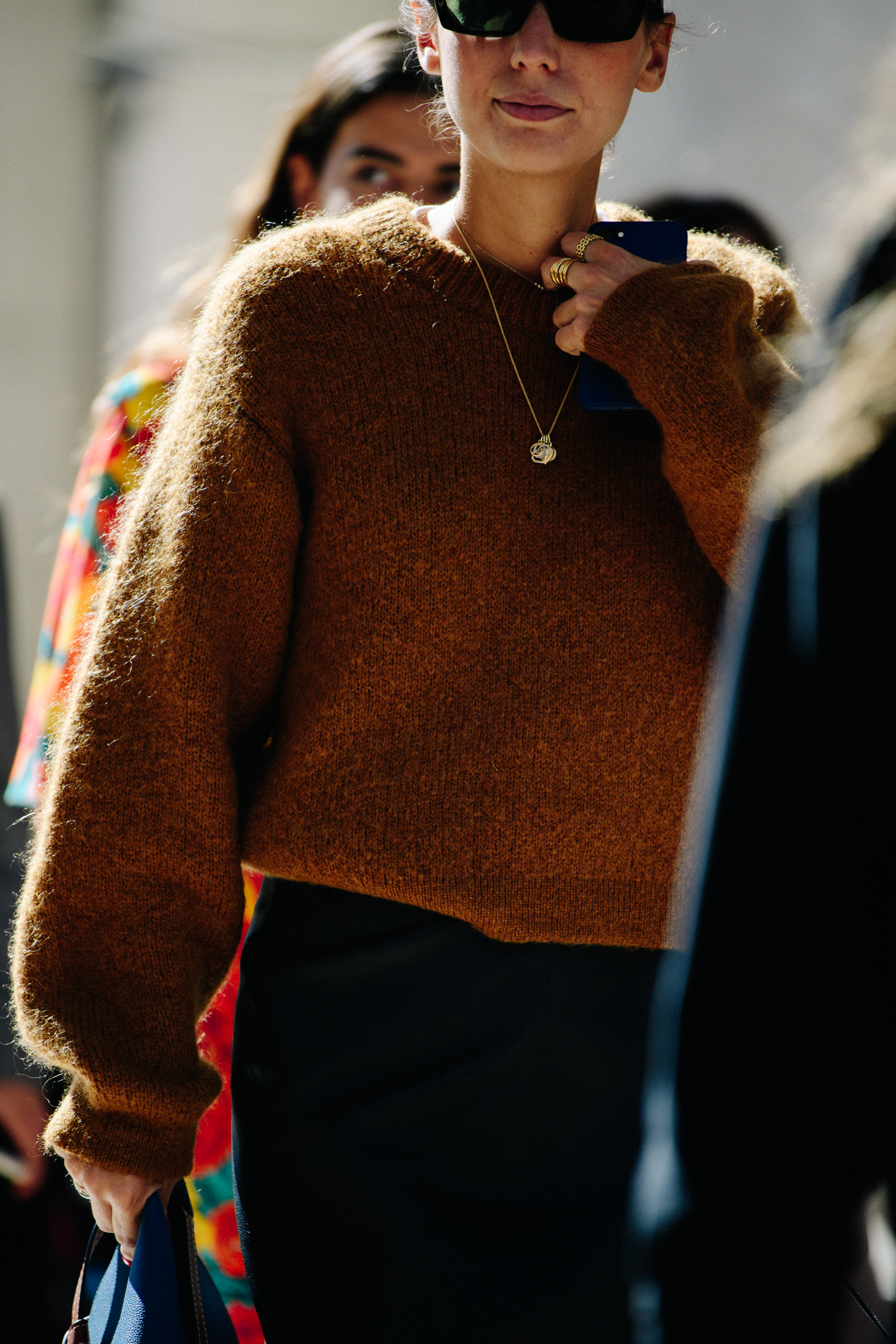 Woman wearing brown jumper