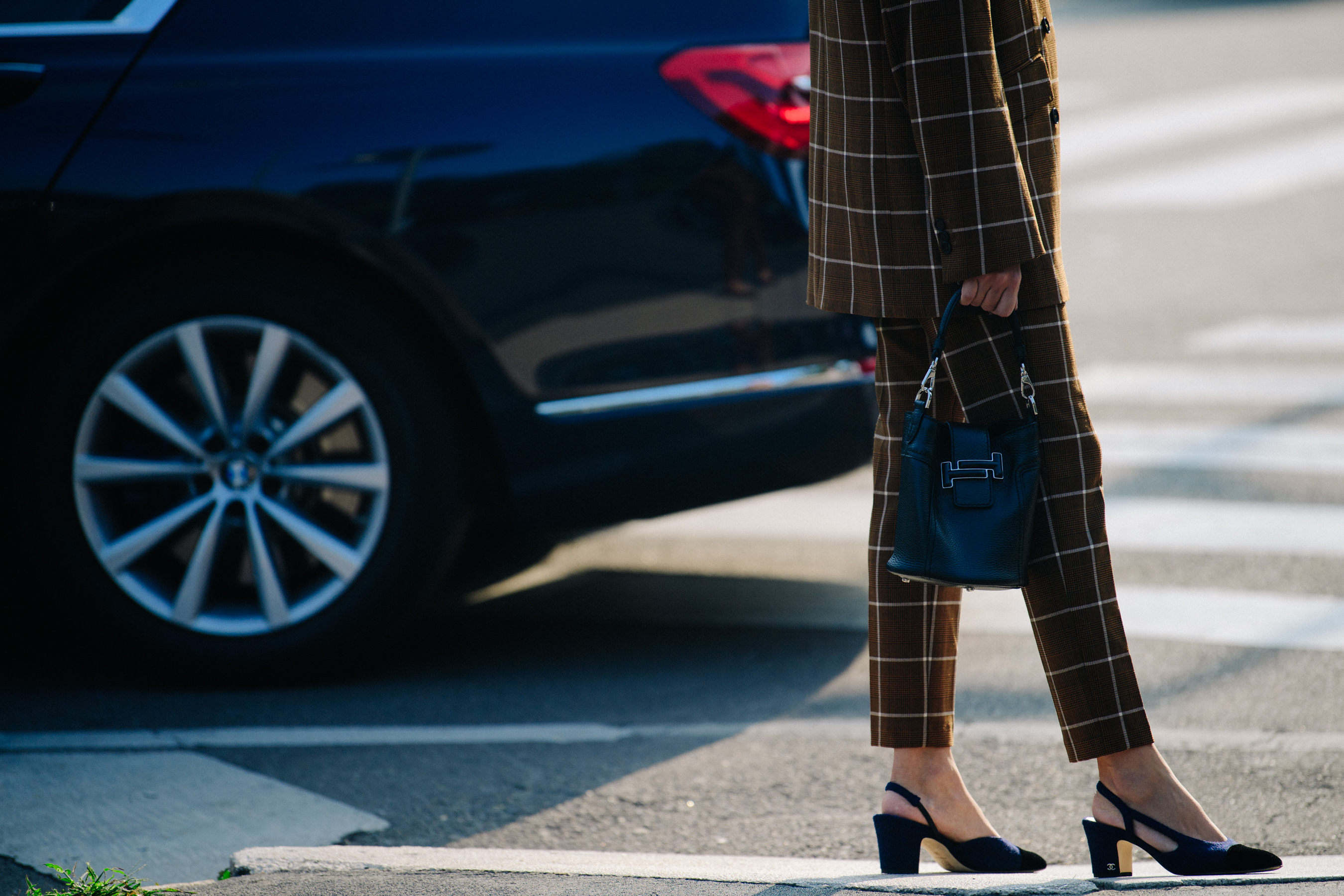Woman wearing brown check suit