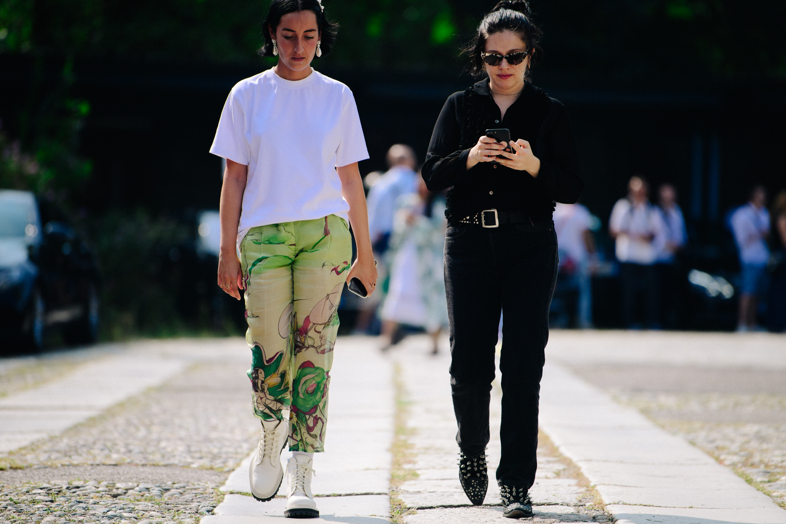 Two women wearing white and black