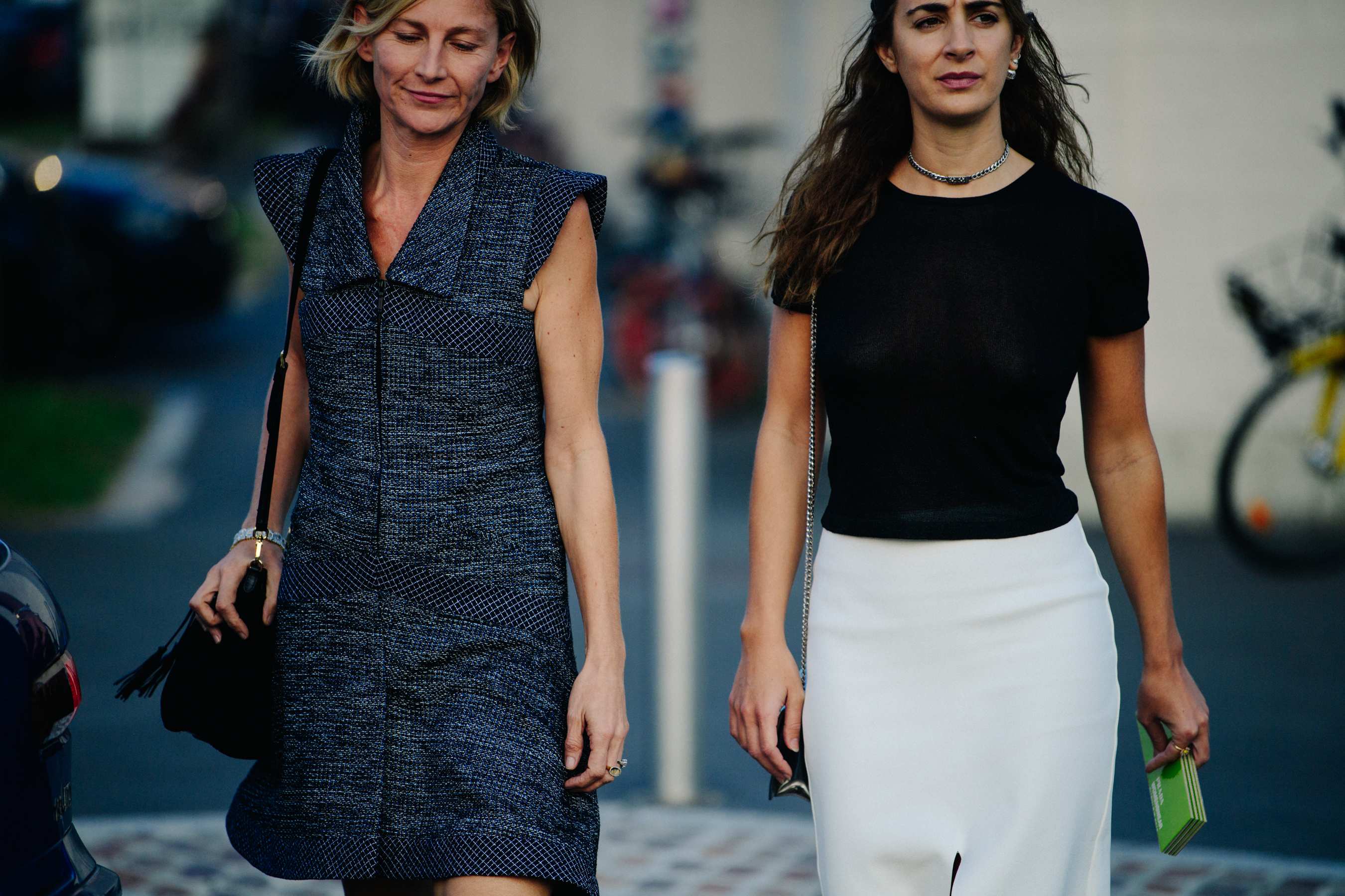 Two women wearing black and white