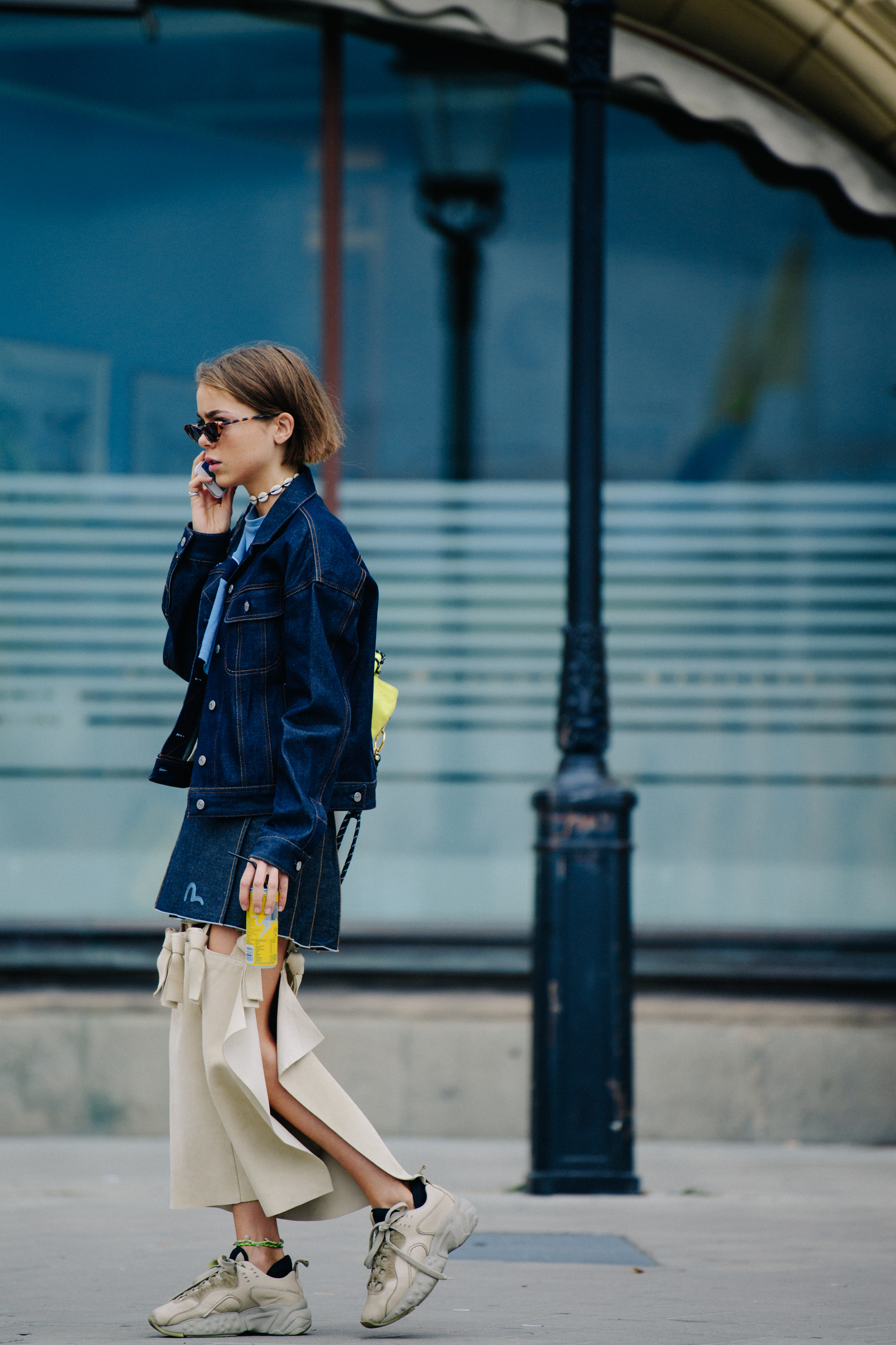 Woman wearing denim skirt and jacket