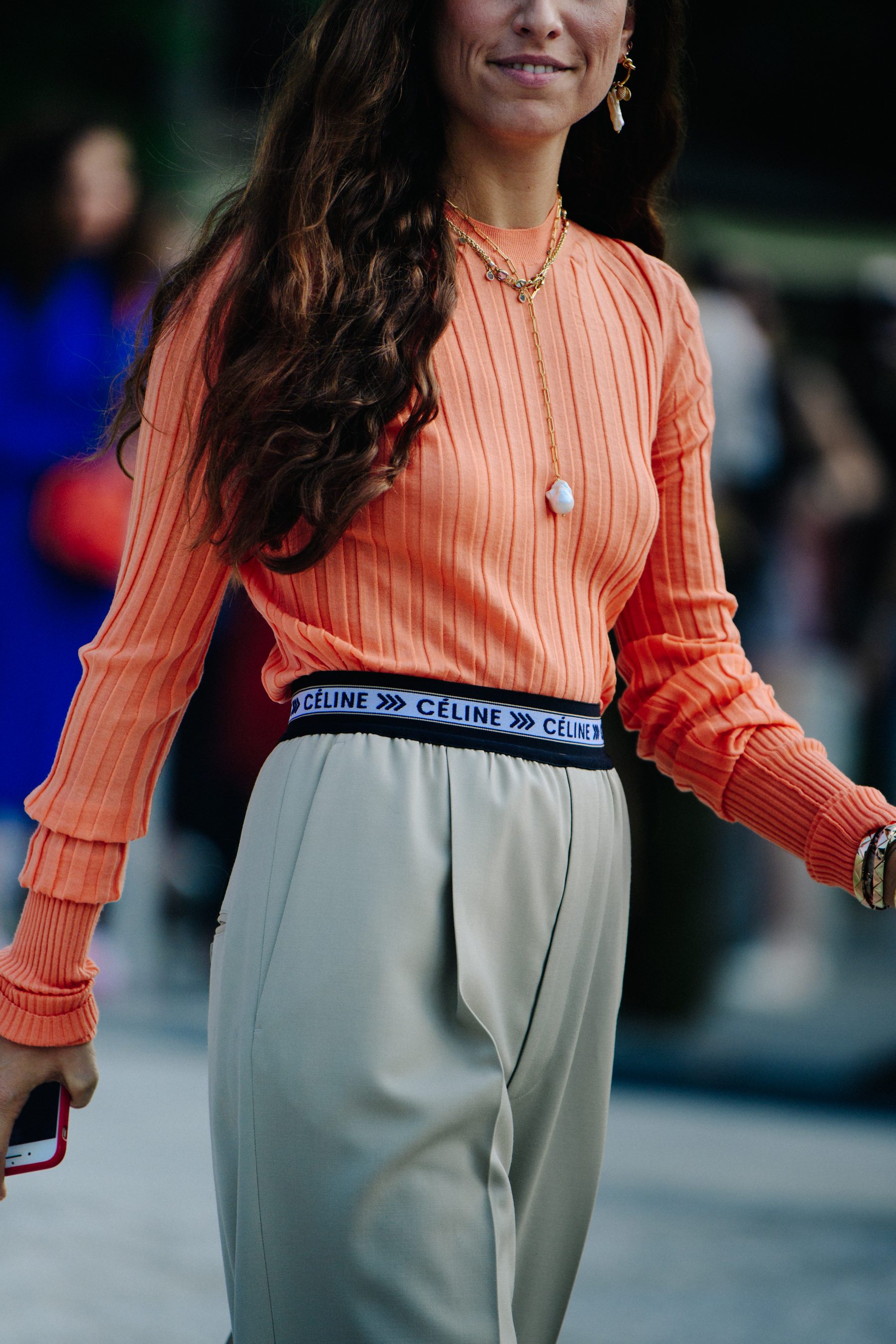 Woman wearing orange top