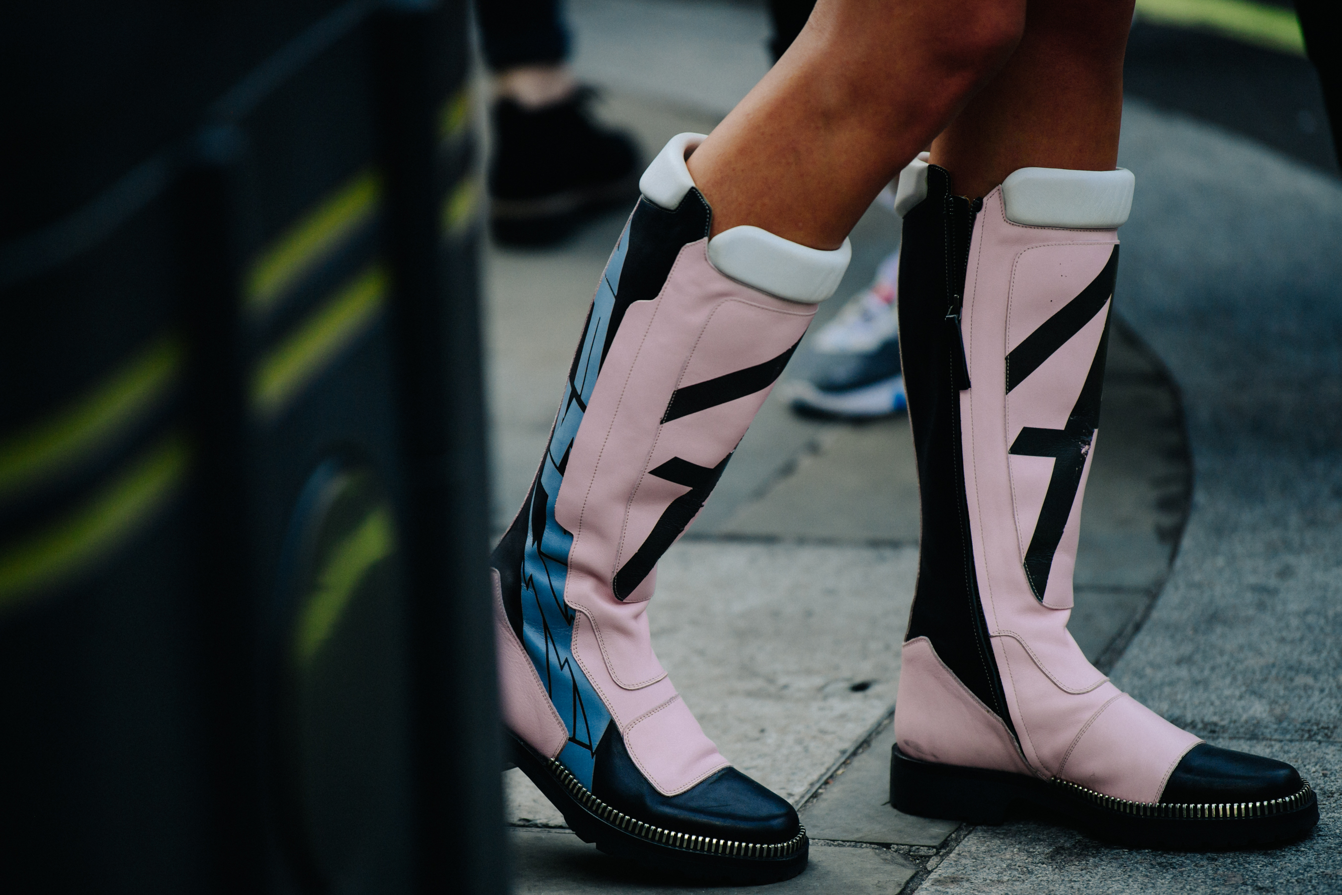Woman wearing pink leather boots
