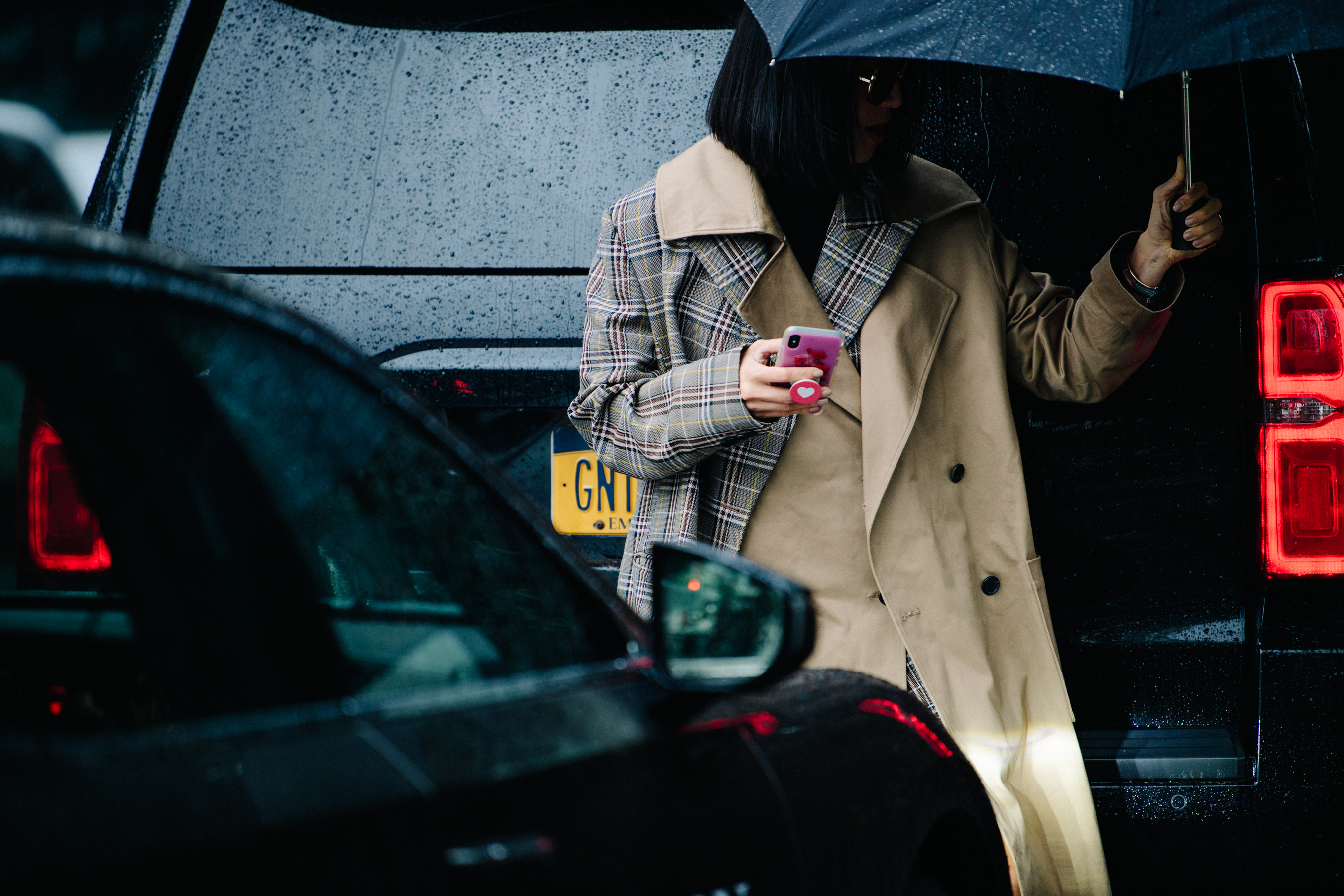 Woman wearing check trench coat