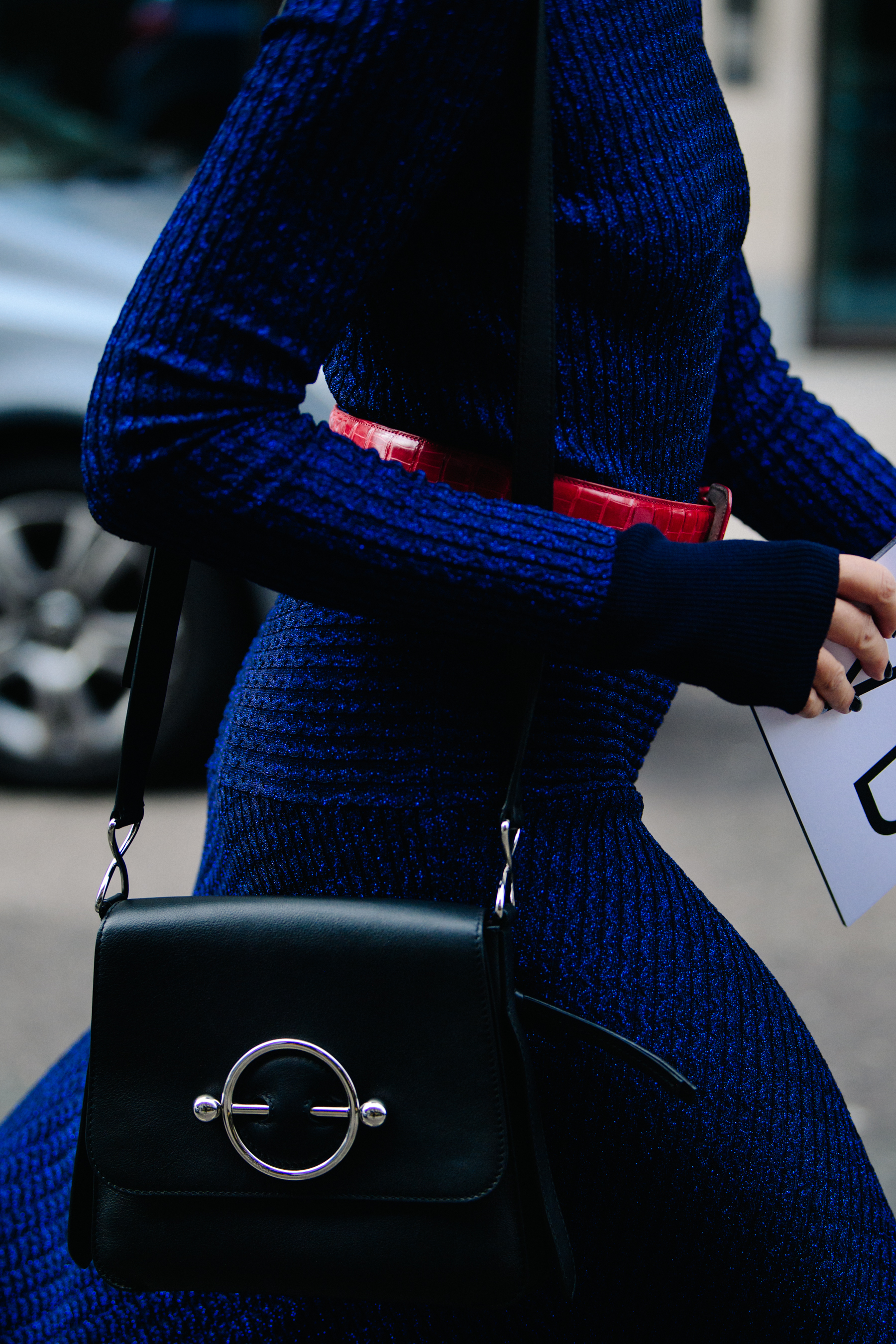 Woman carrying JW Anderson bag