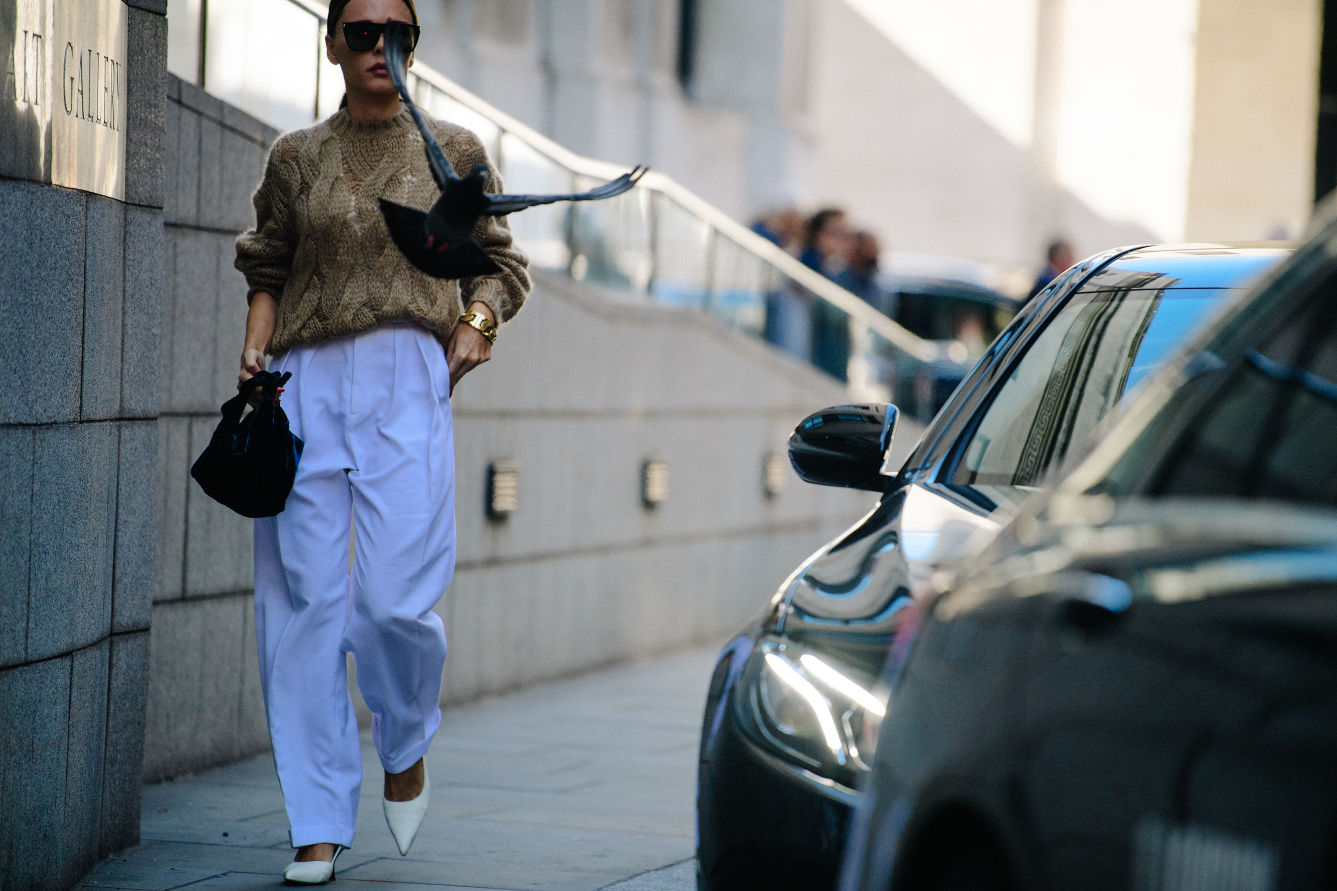 Woman wearing white pants