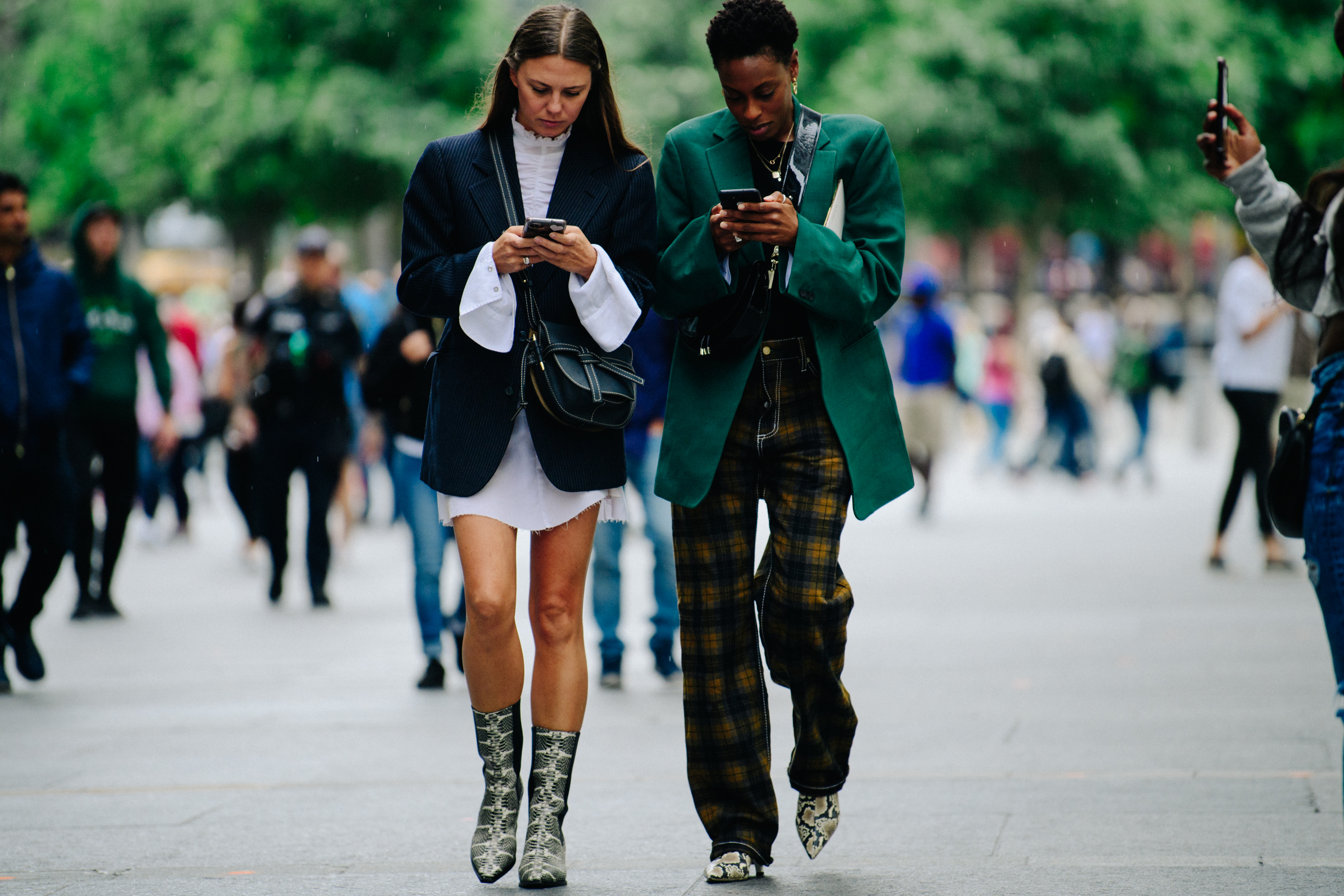 Two British women wearing snakeskin boots