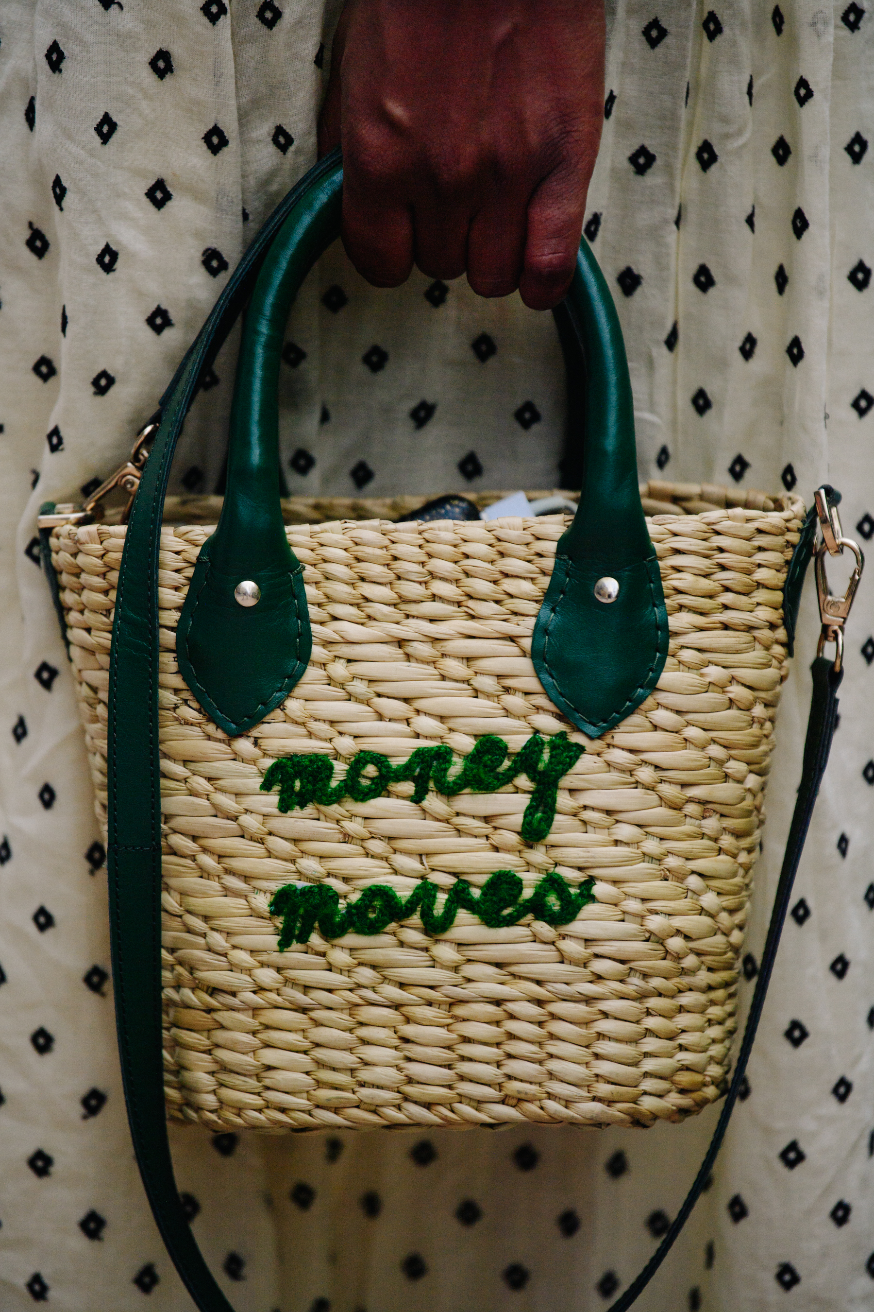 Woman carrying wicker bag
