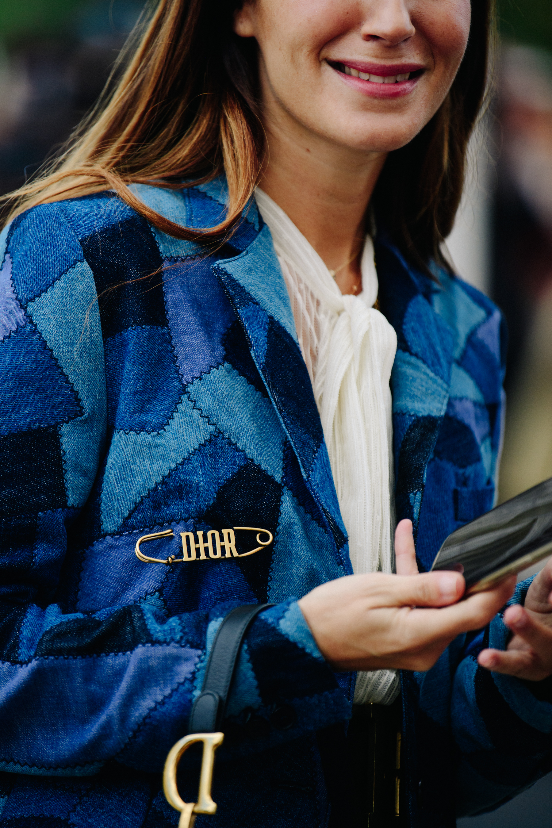 Woman wearing Christian Dior pin