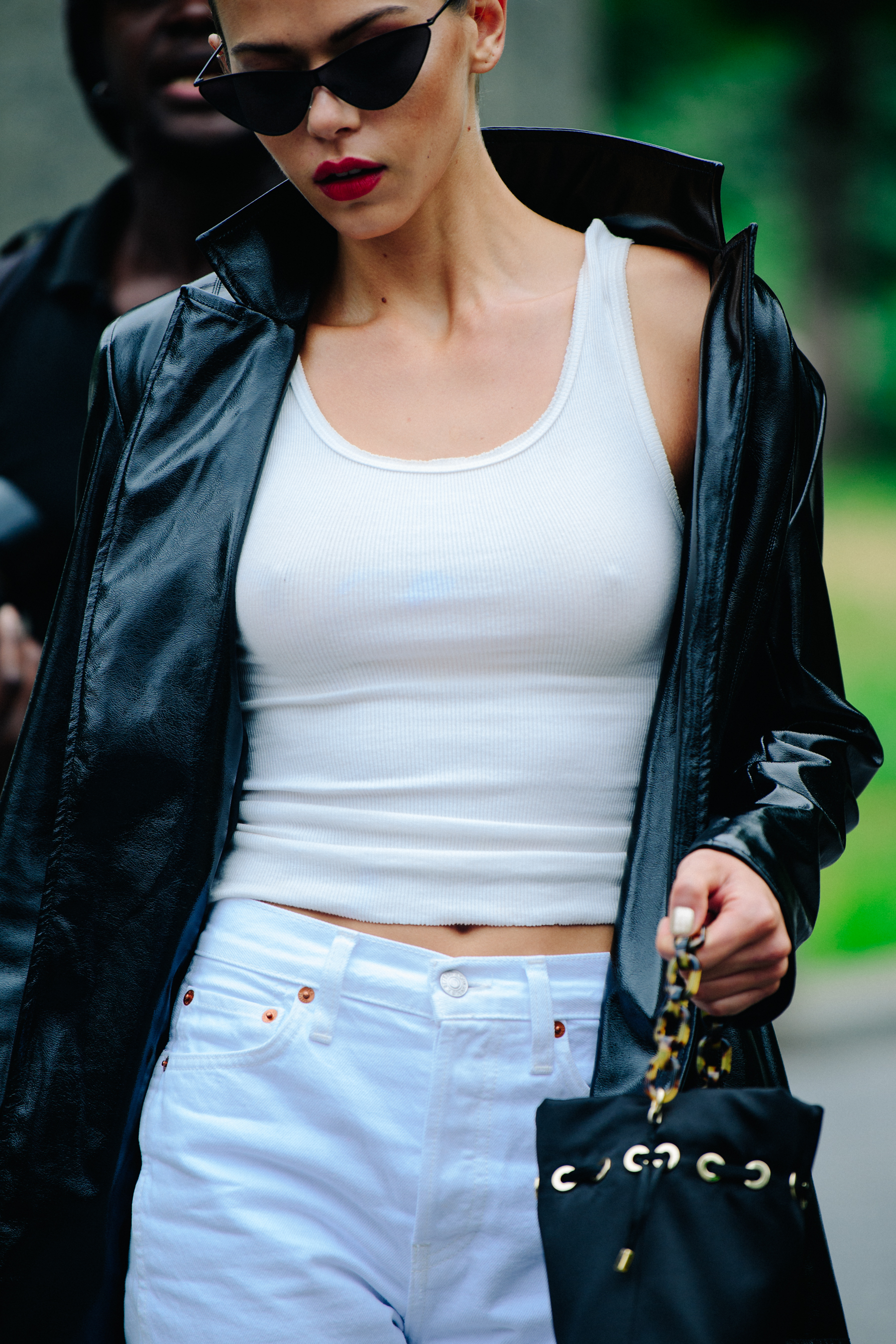 Model wearing white vest