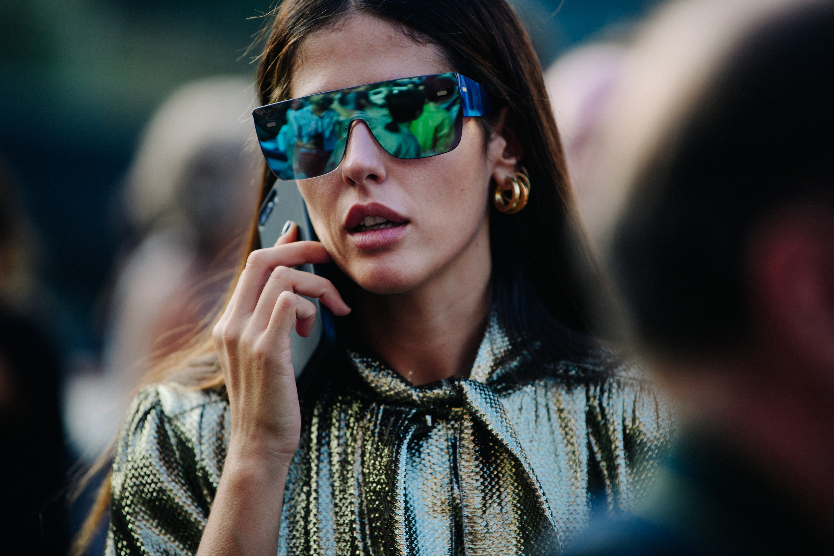 Italian woman wearing colourful sunglasses