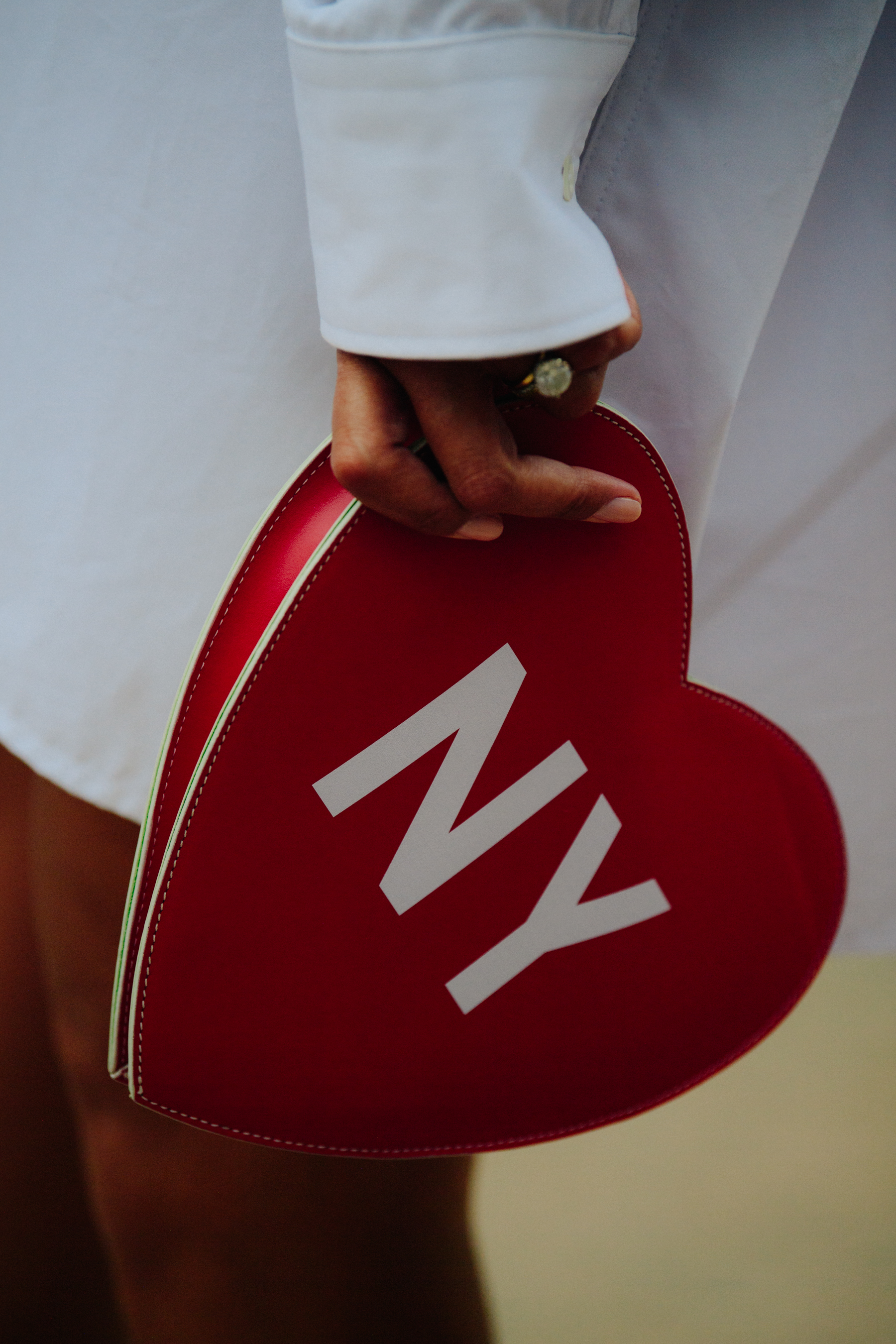 Woman carrying leather heart bag