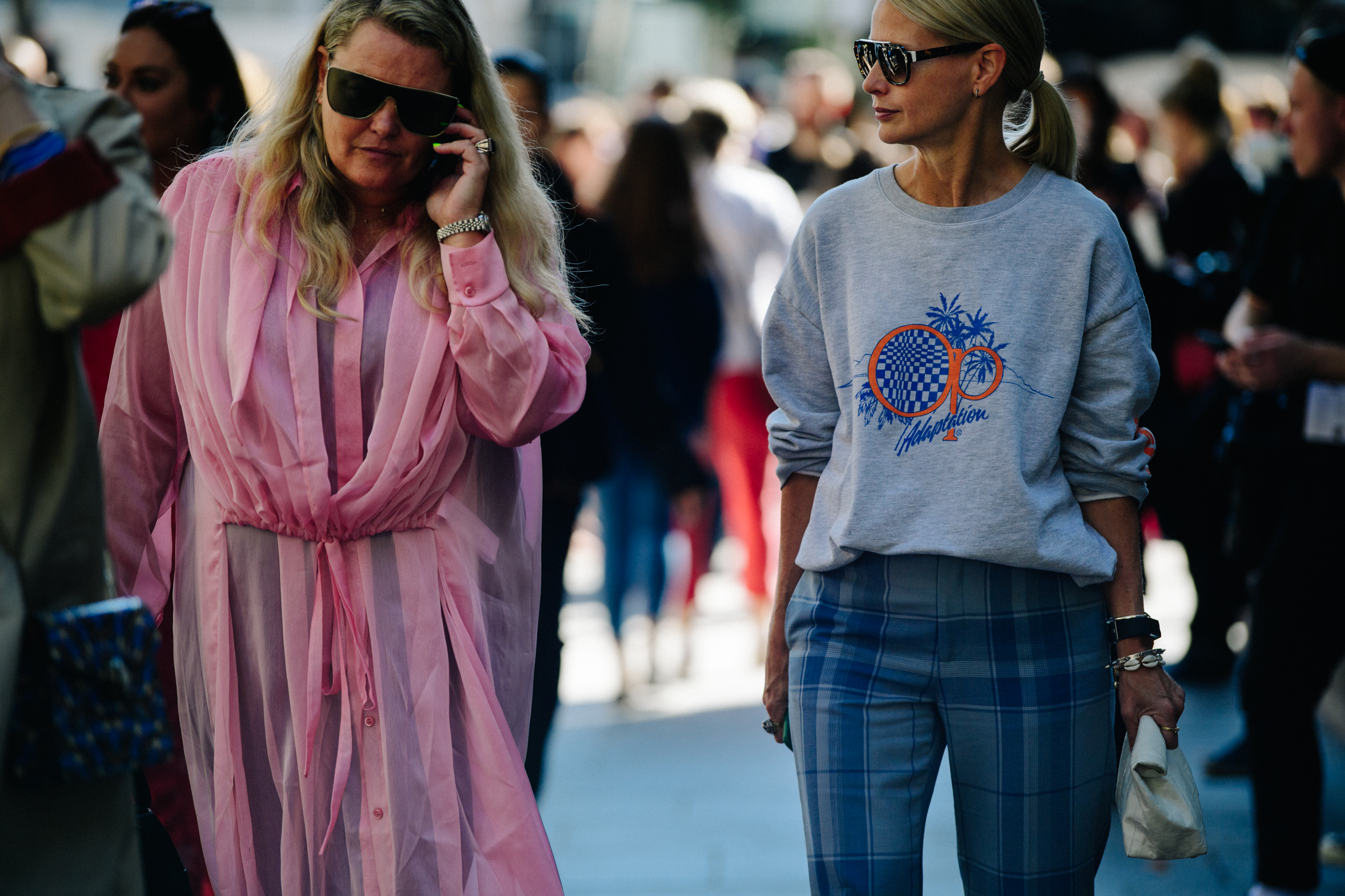 Two women wearing pink and grey