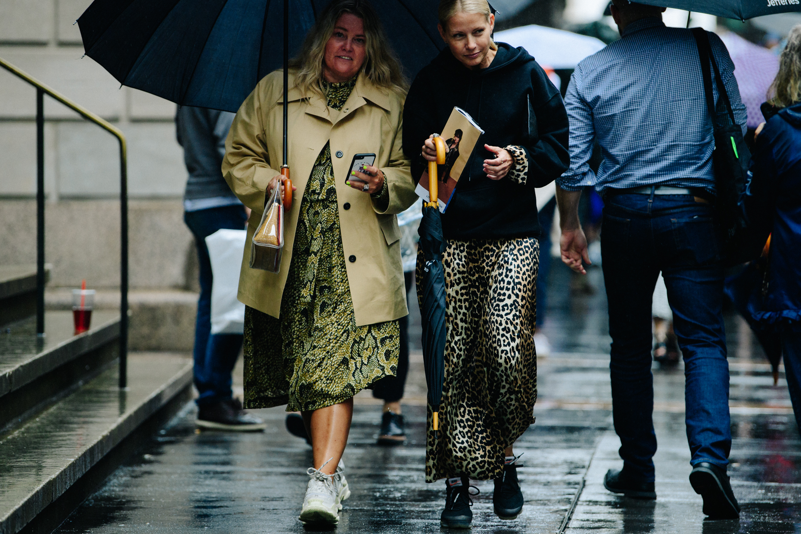 Two women wearing animal print clothing