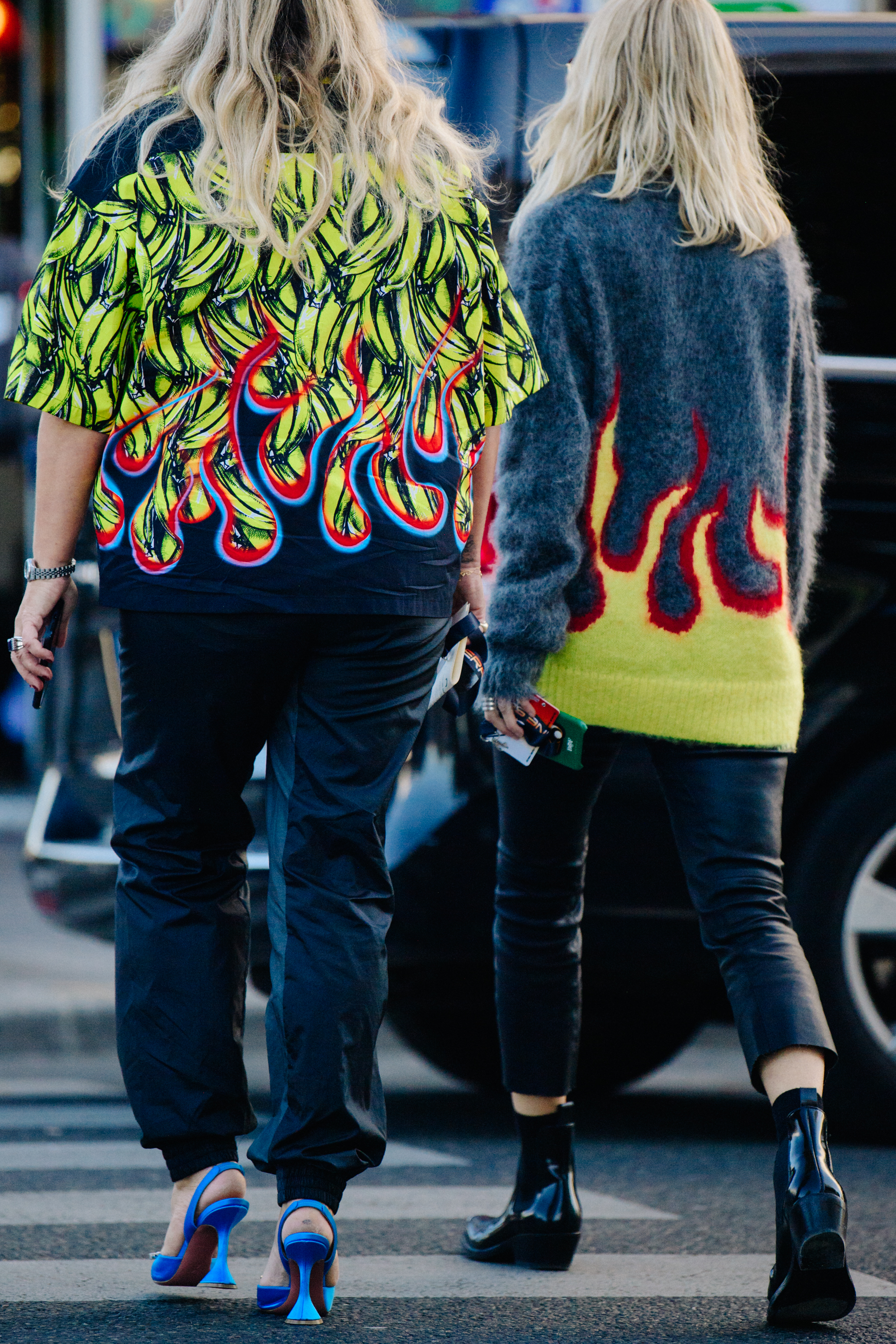 Two women wearing Prada