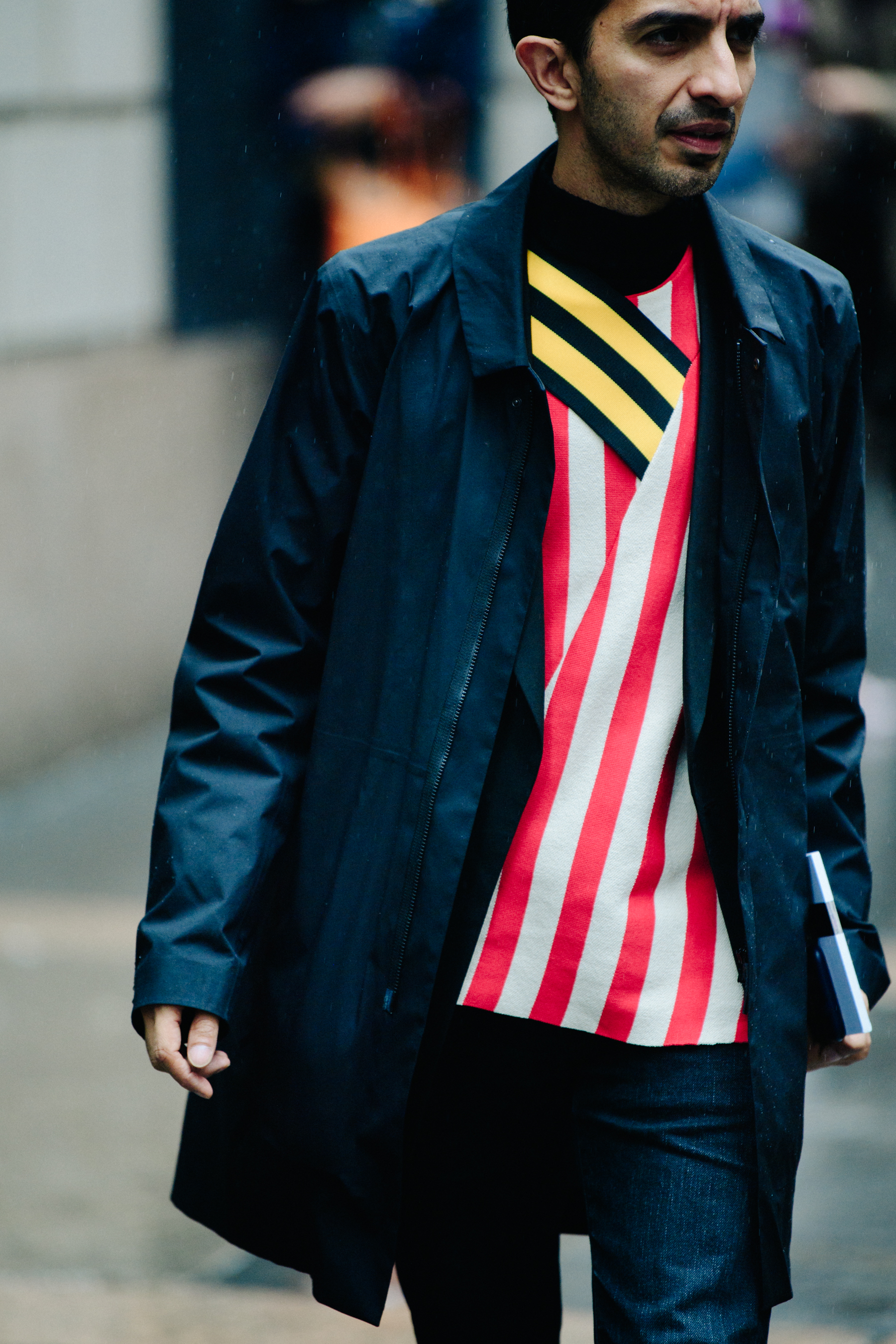 Man wearing red striped top