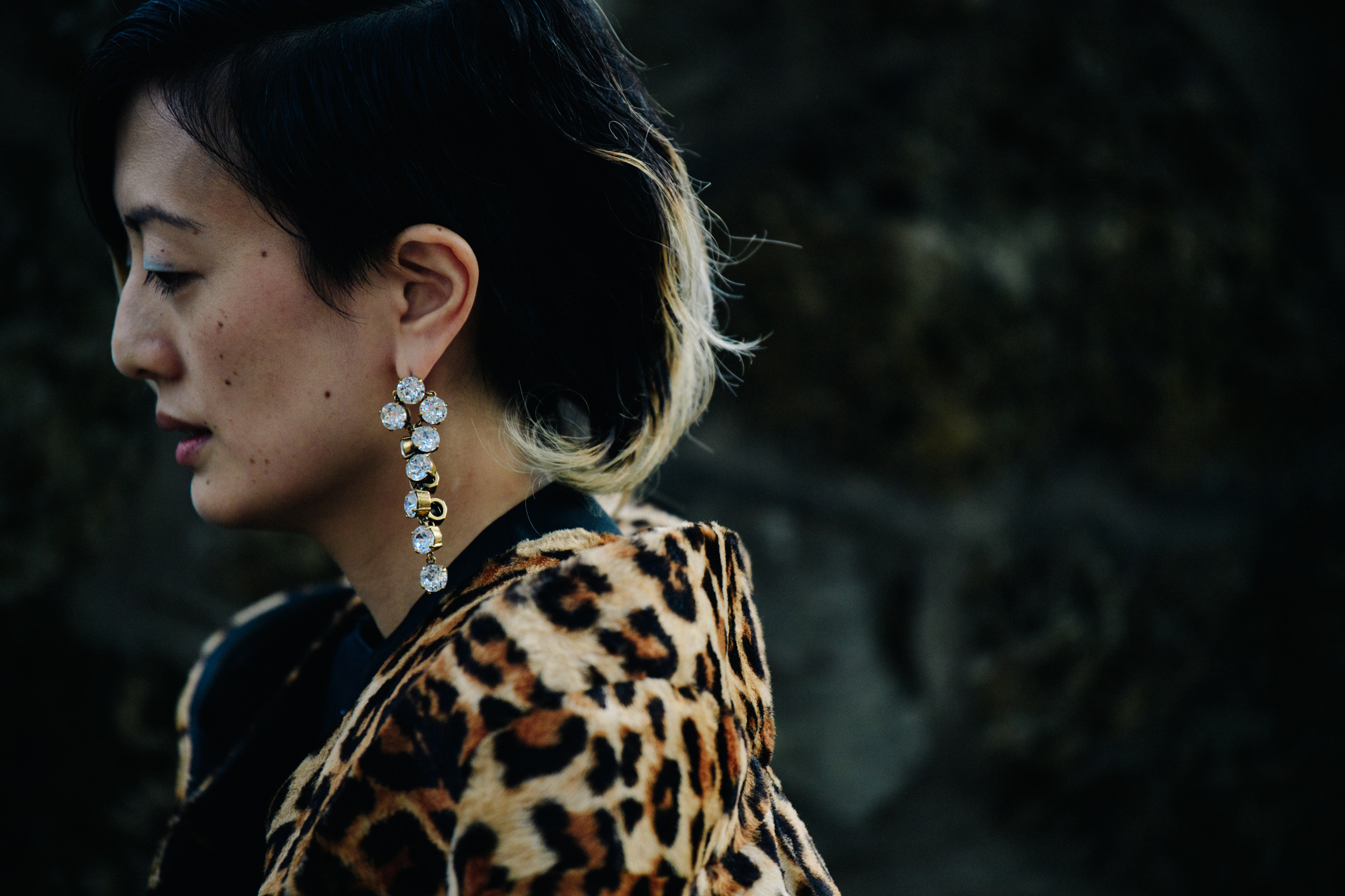 Woman wearing gold diamond earring