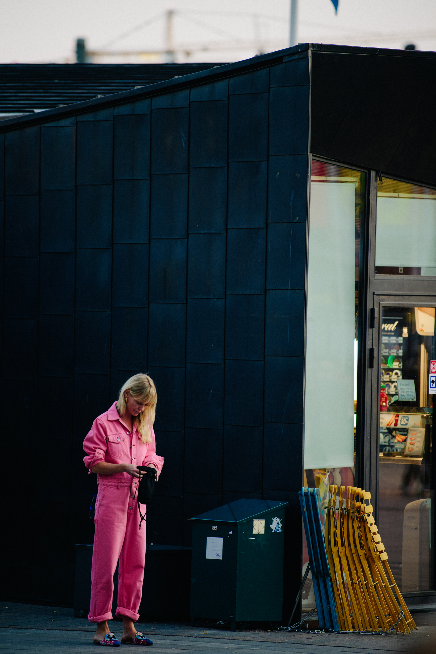Woman wearing pink denim jumpsuit