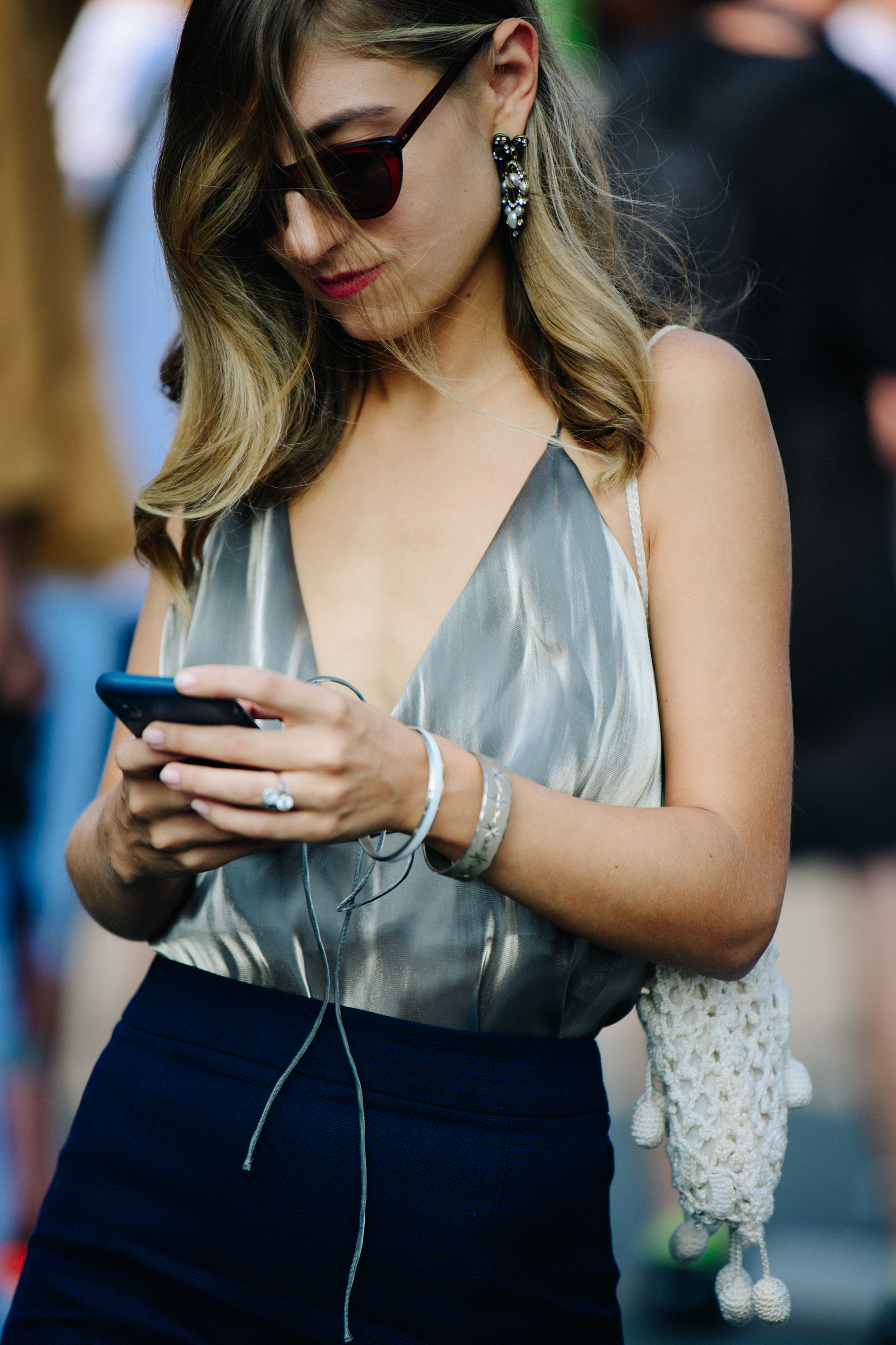 Woman wearing silver top
