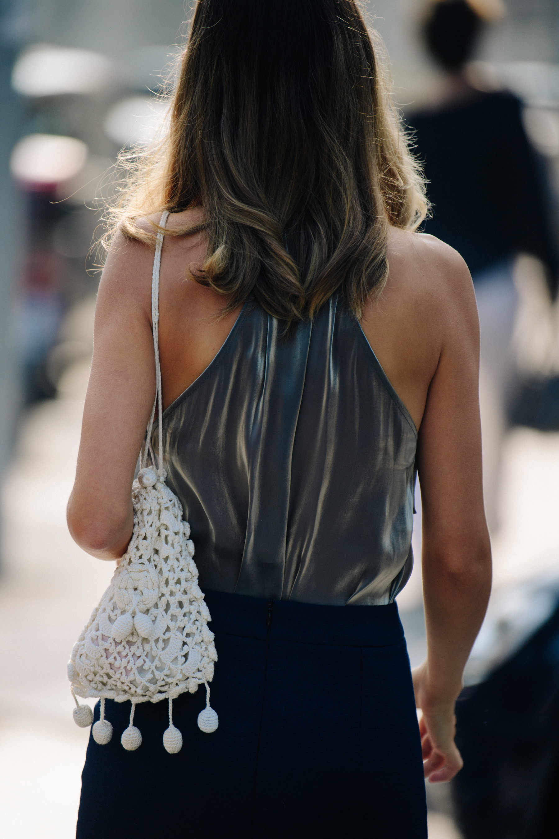 Woman wearing silver top