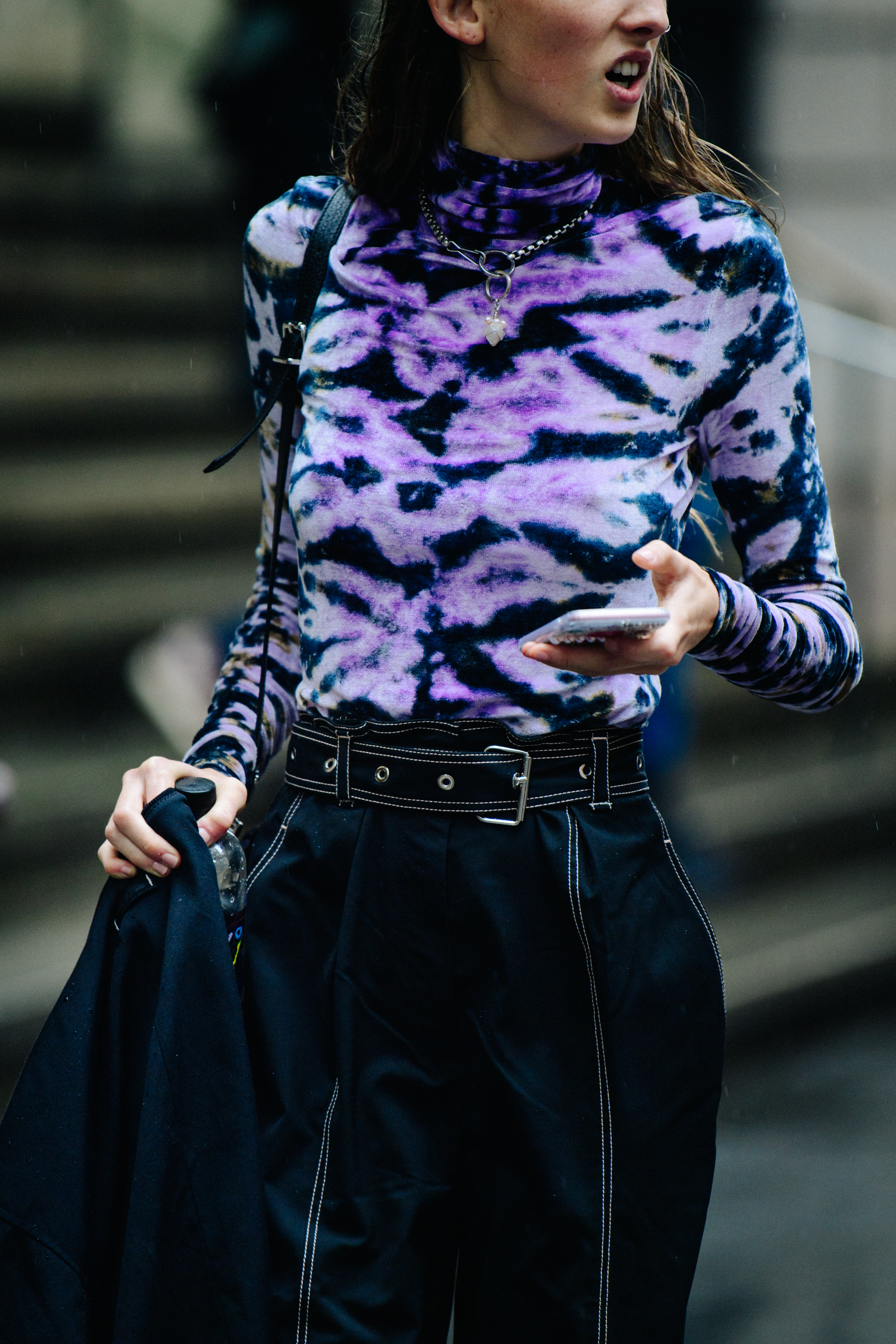 Model wearing purple top
