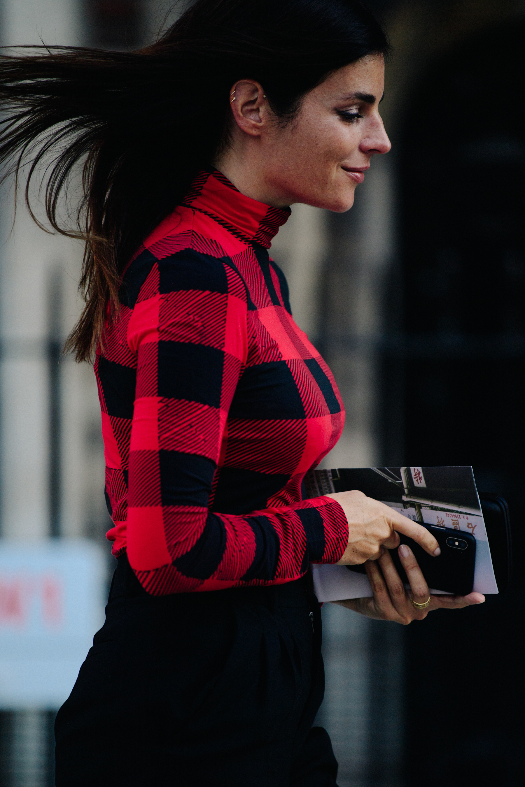Woman wearing red check jumper