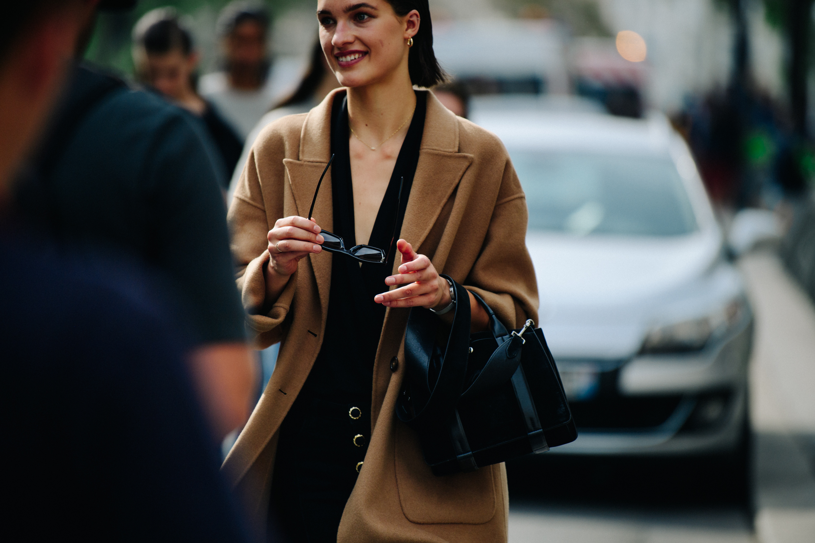 Dutch model wearing tan coat