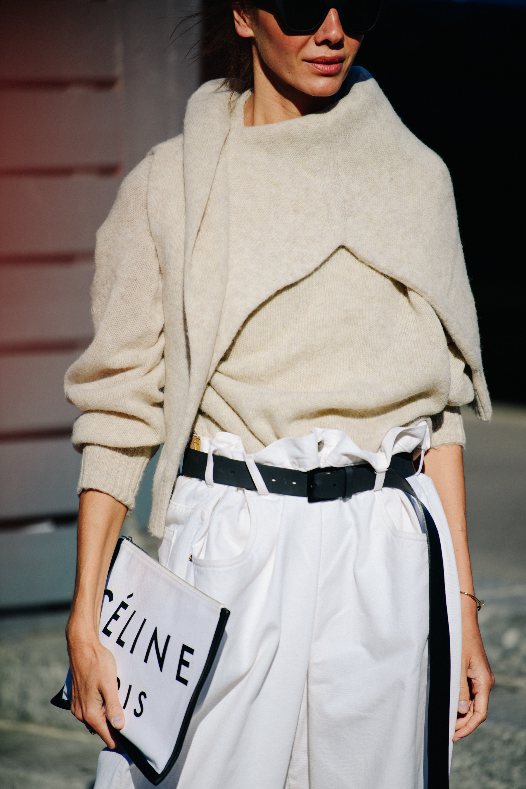 Woman wearing white pants