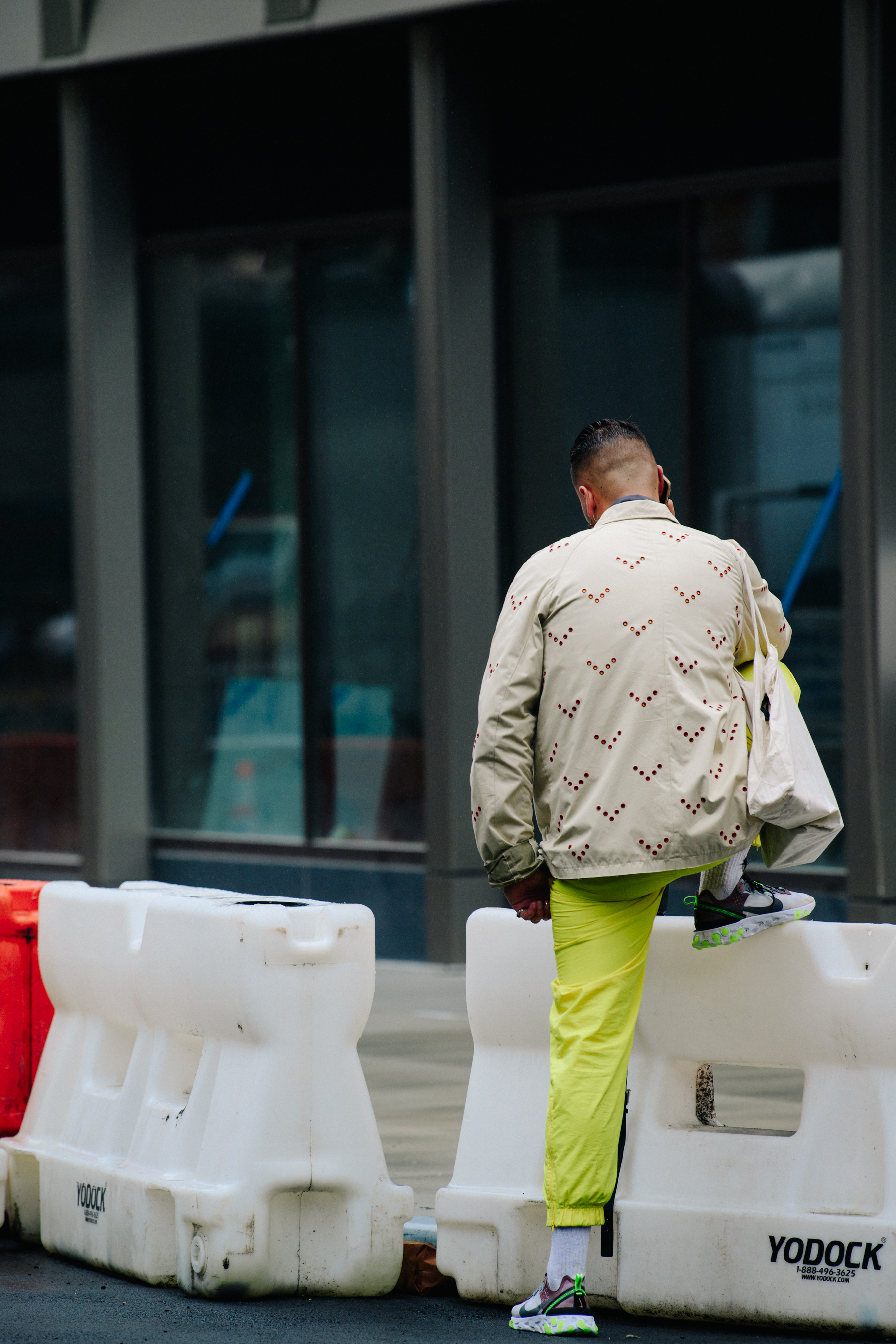 French photographer wearing yellow pants
