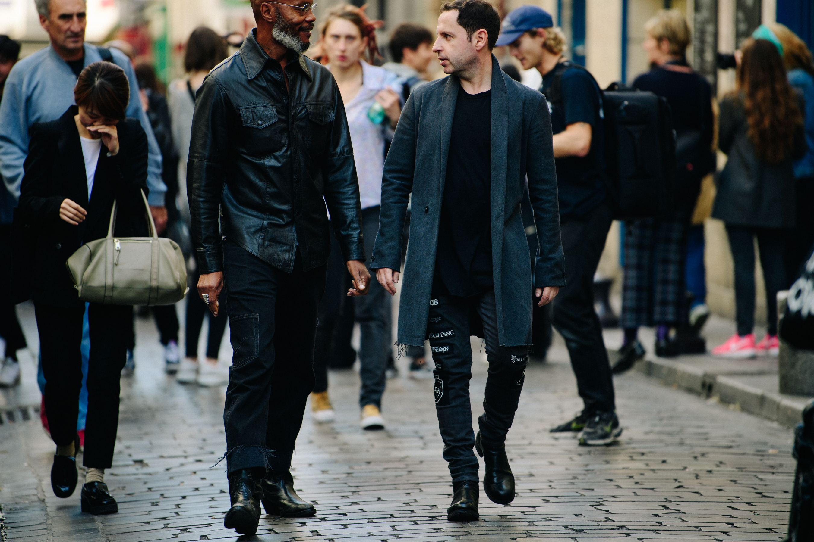 Two men wearing dark clothing
