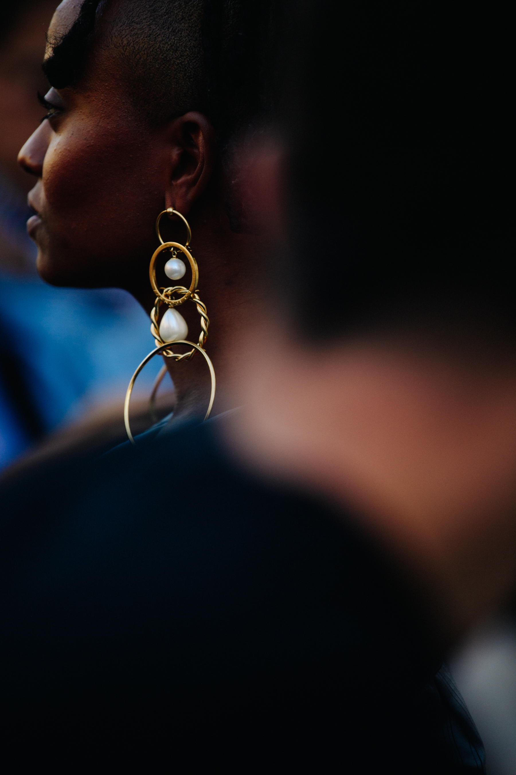 Woman wearing gold earring