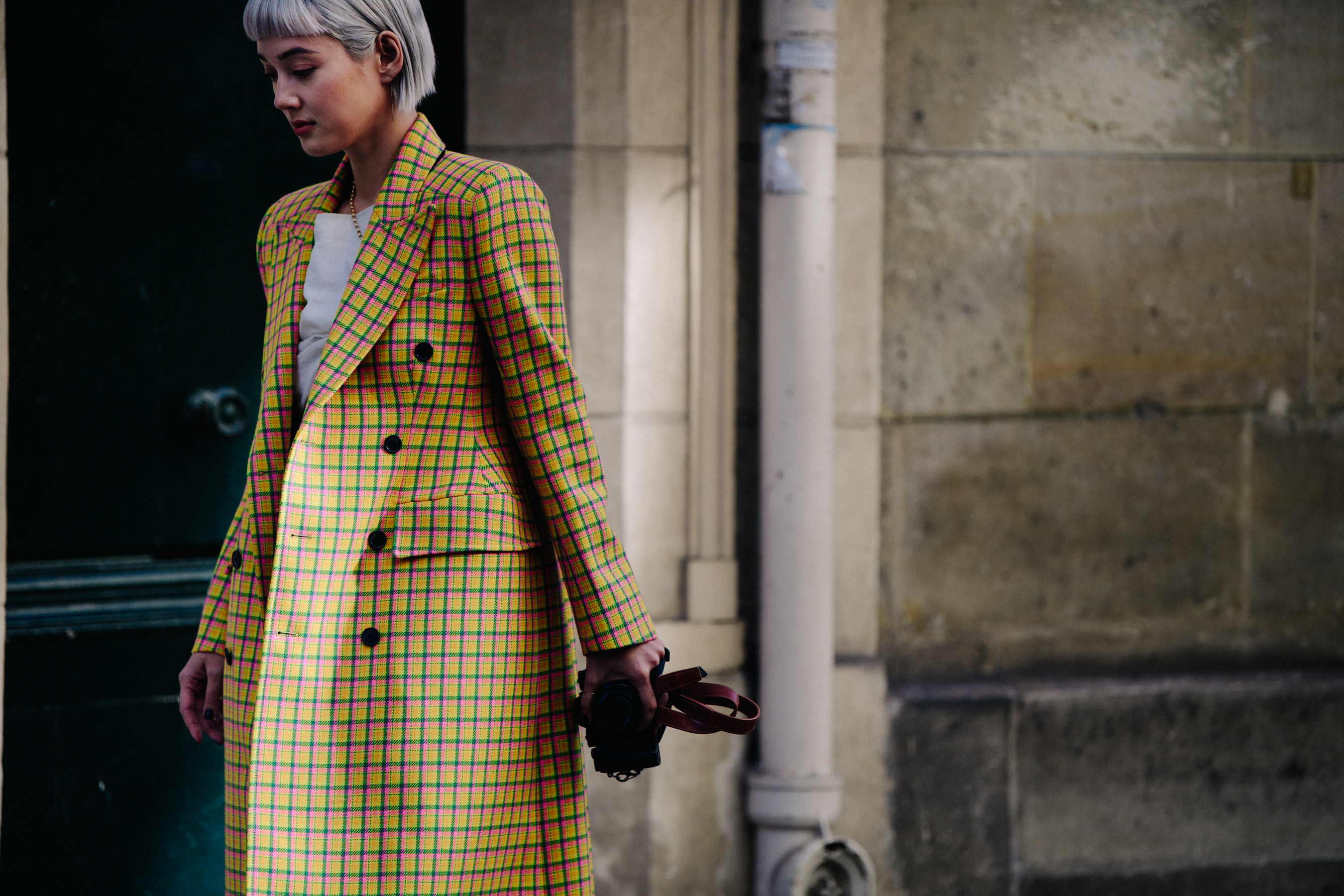 Woman wearing colourful check coat