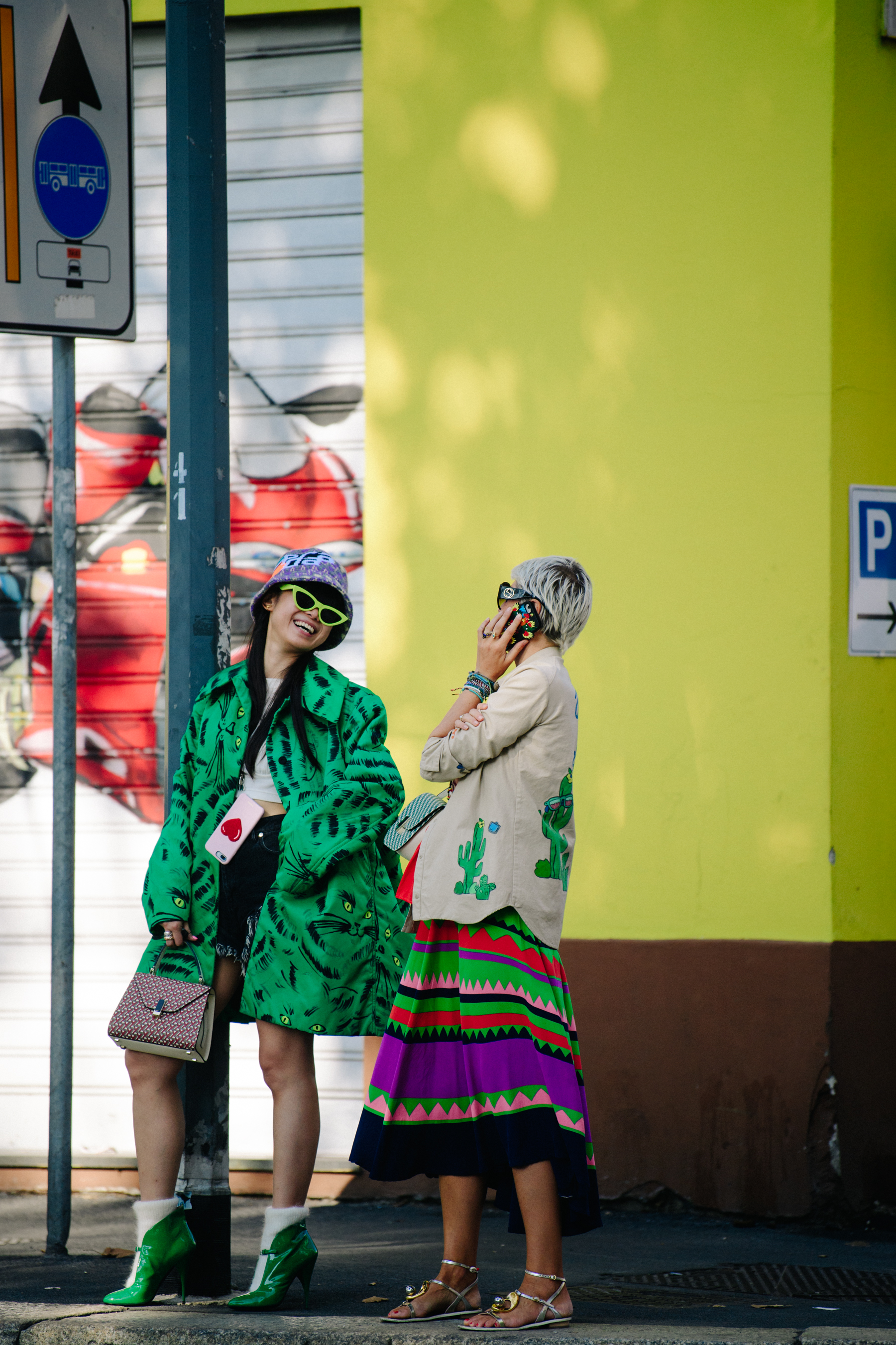 Two women wearing pattern outfits