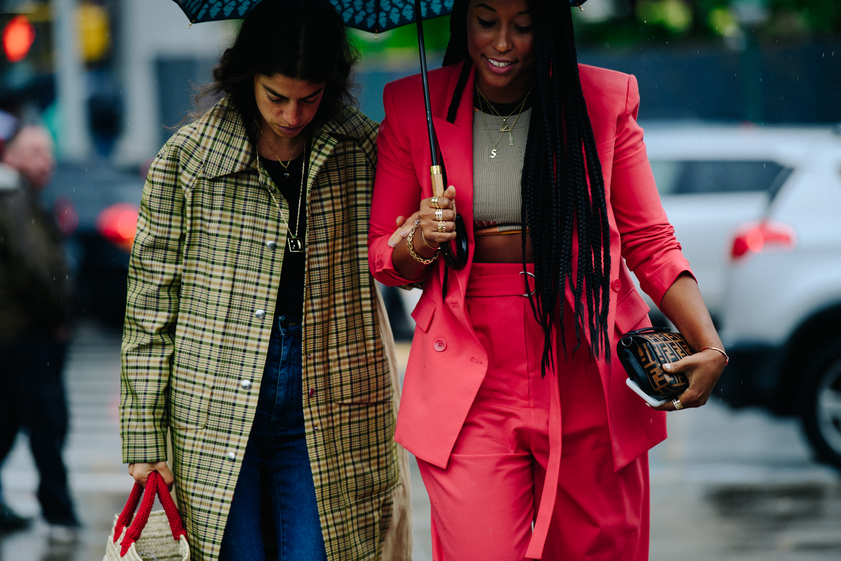 Two women wearing long outfits