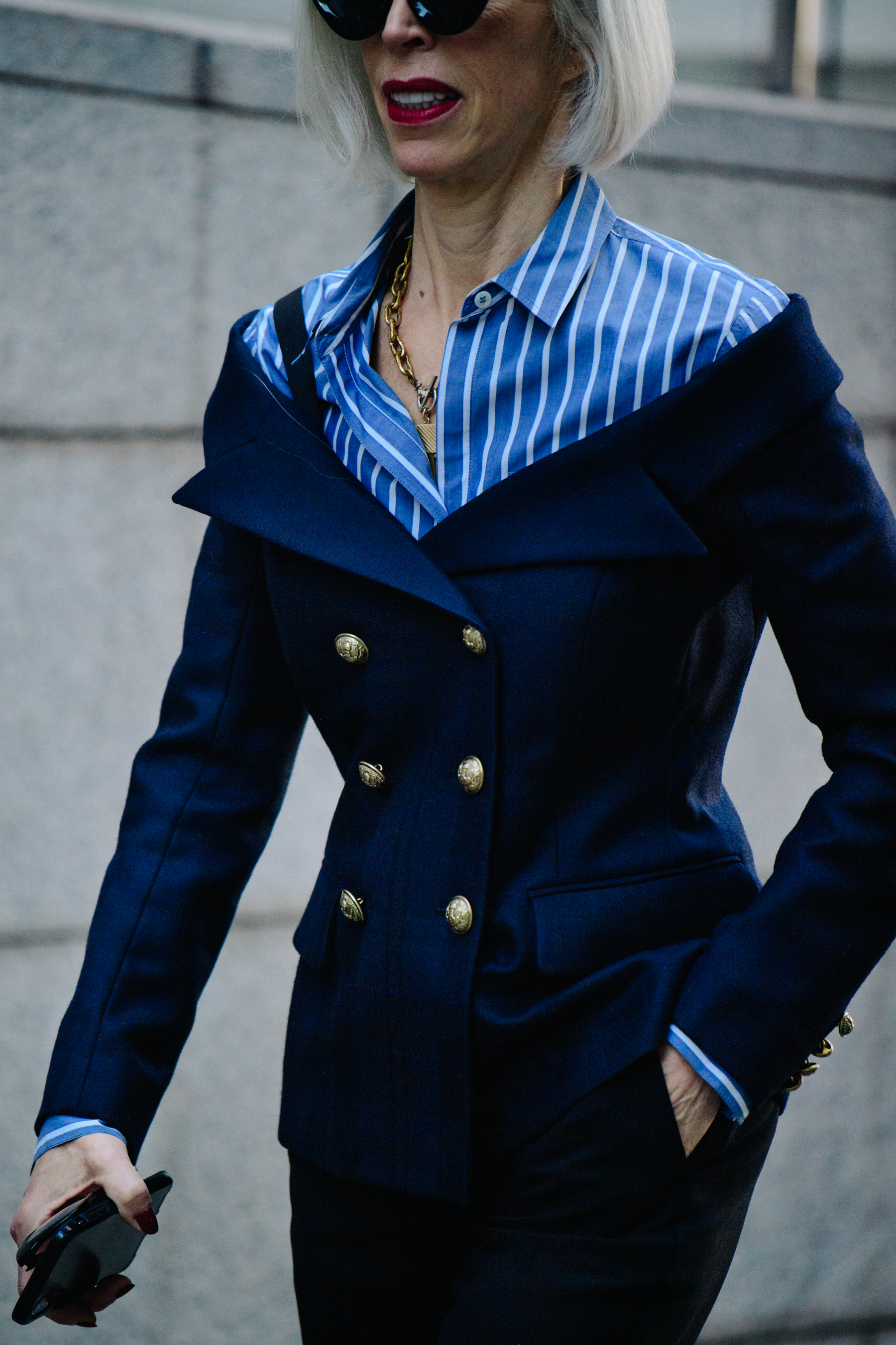 Woman wearing blue striped shirt