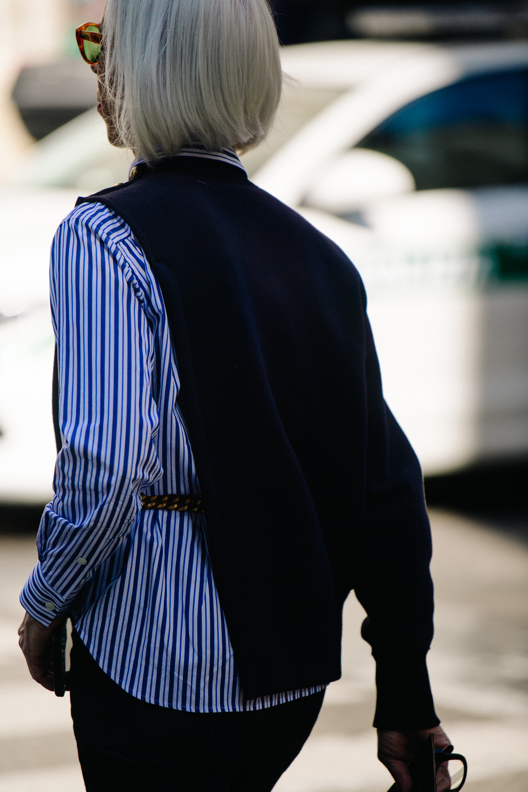 Woman wearing blue striped shirt