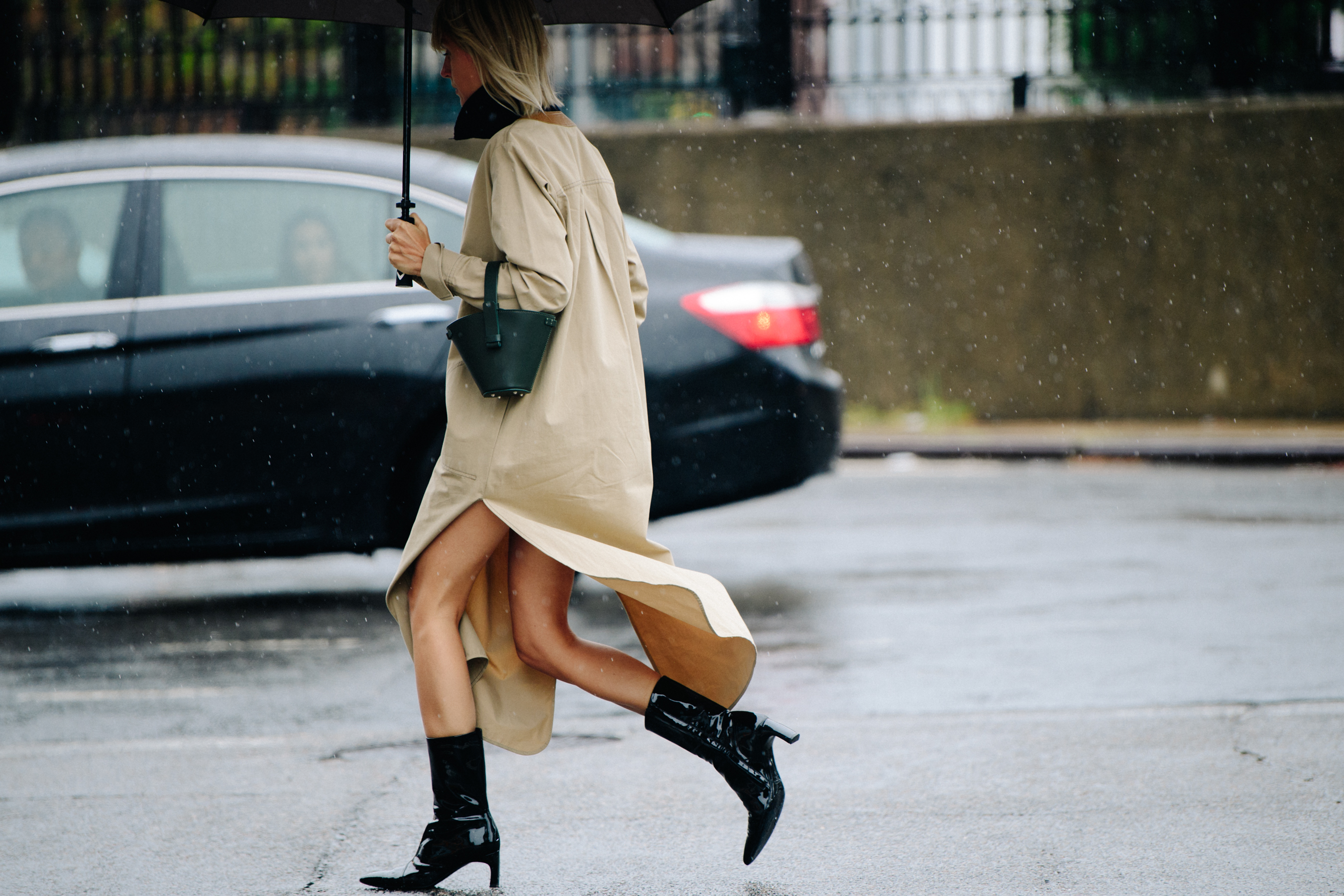 Woman wearing long tan coat