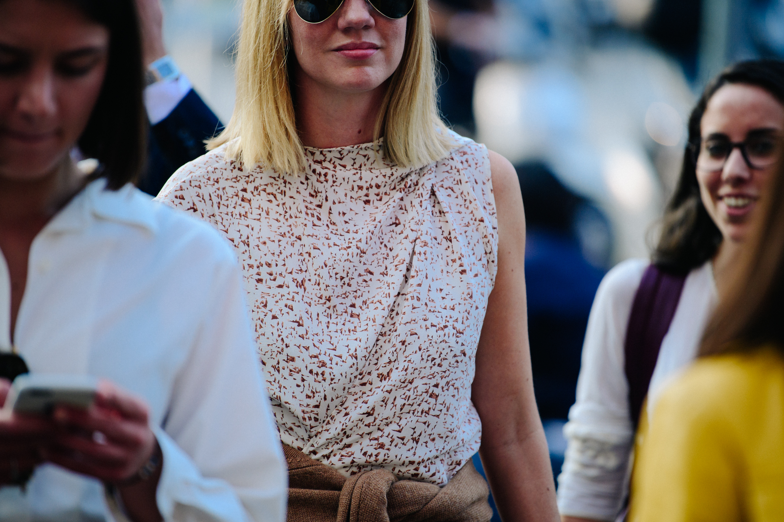 Woman wearing white pattern top