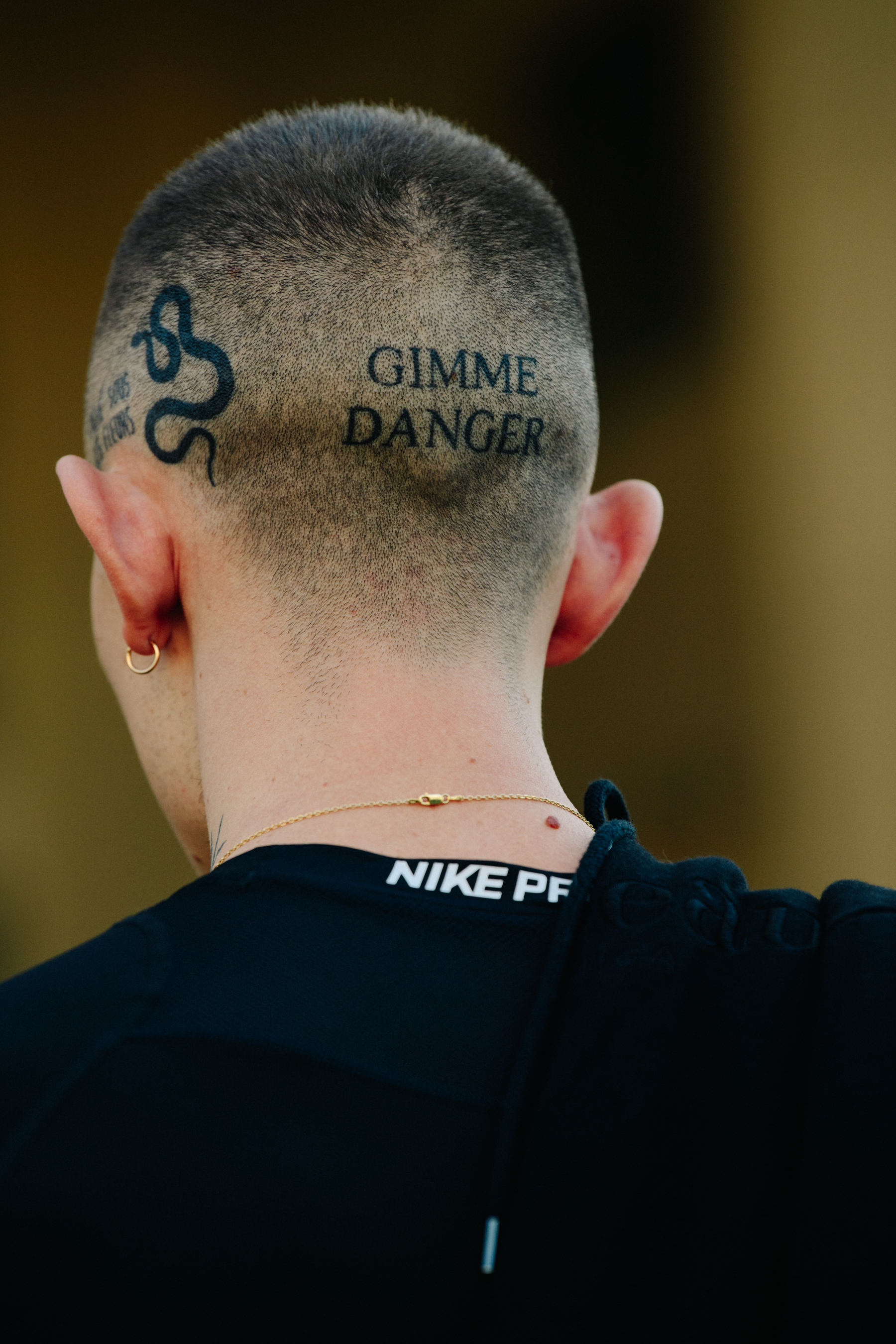 Man with tattooed head