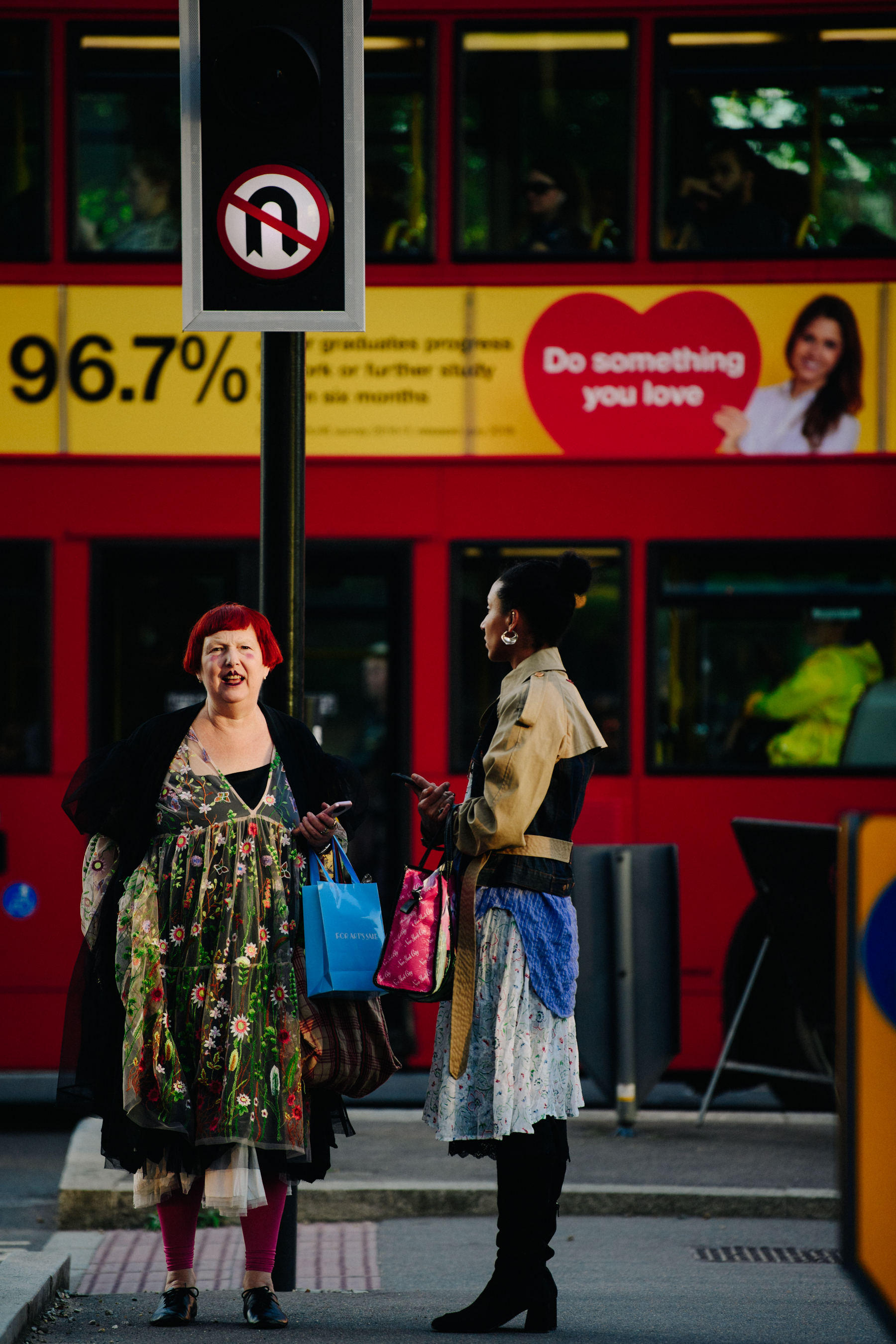 Two women wearing stylish floral clothing