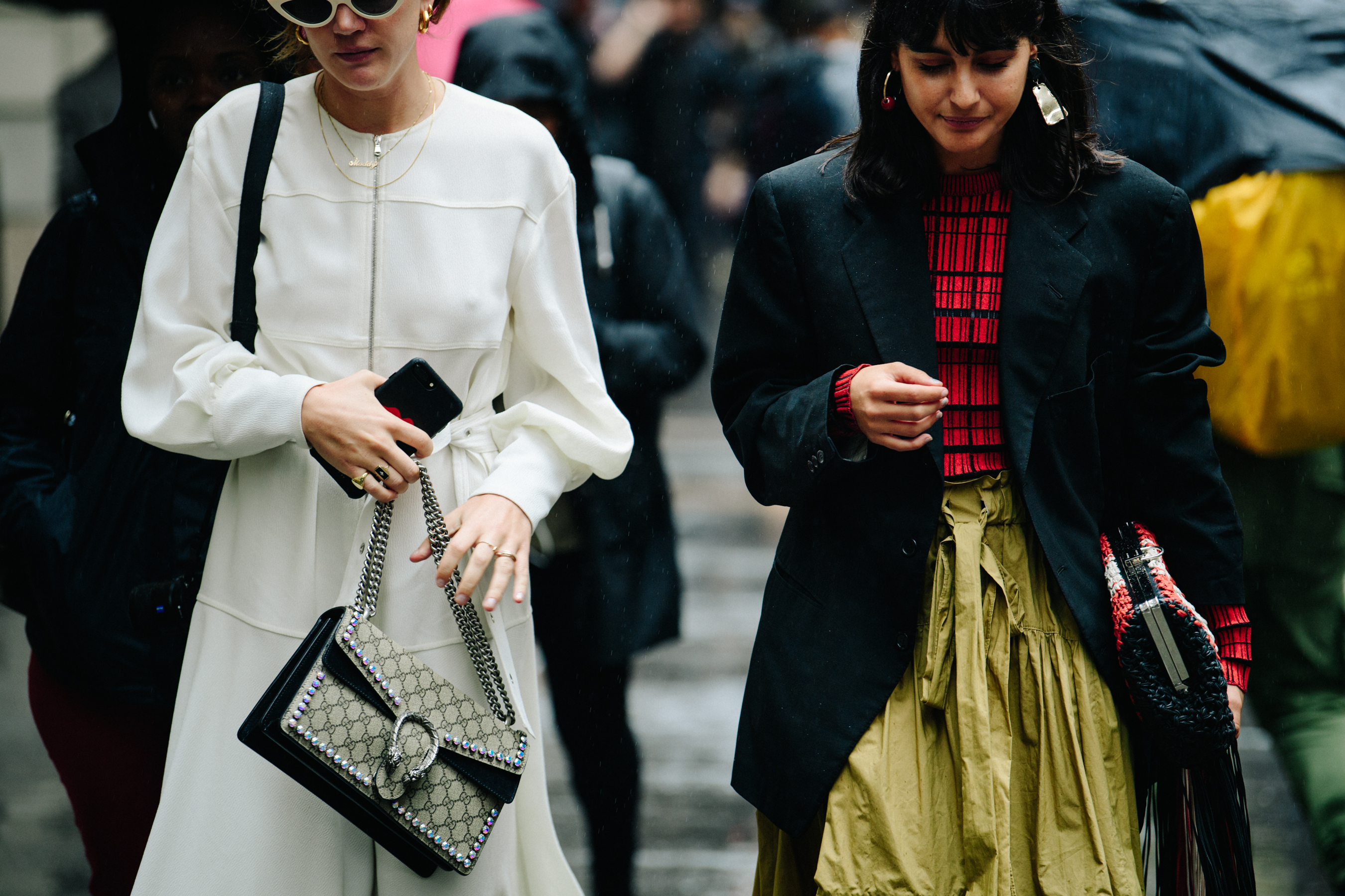 Two women wearing black asnd white