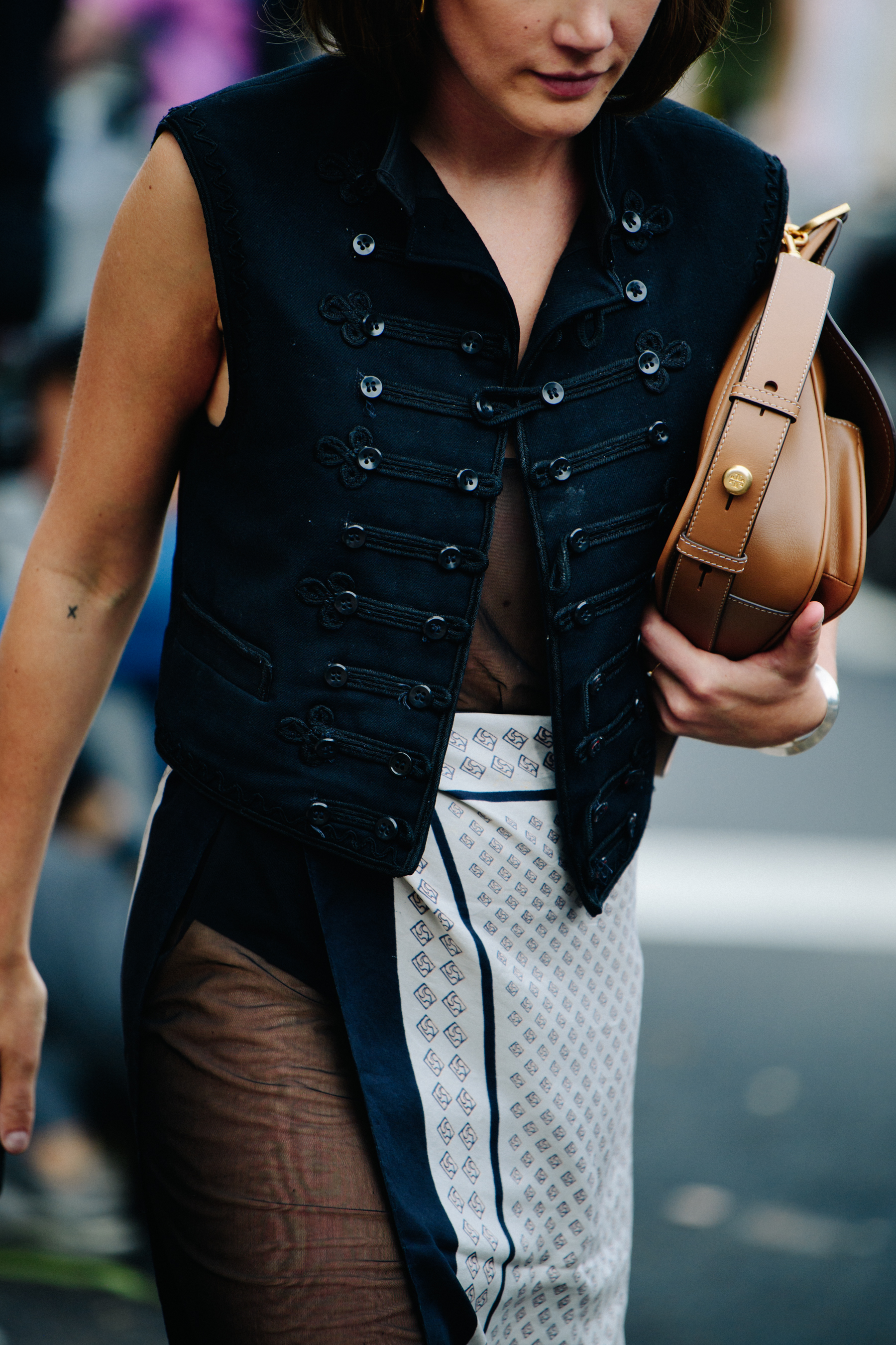 Woman wearing black vest