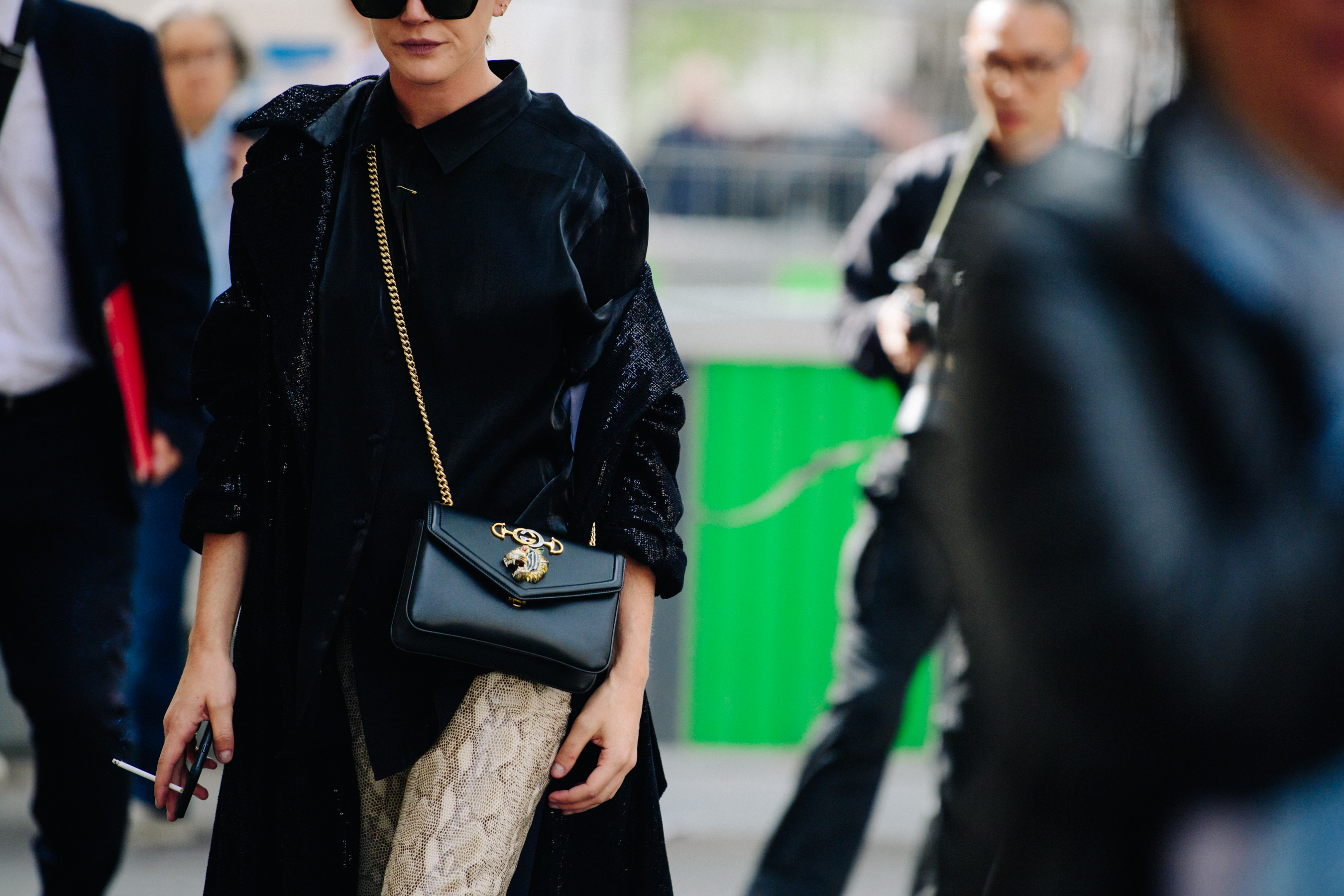 Woman wearing black sequin coat