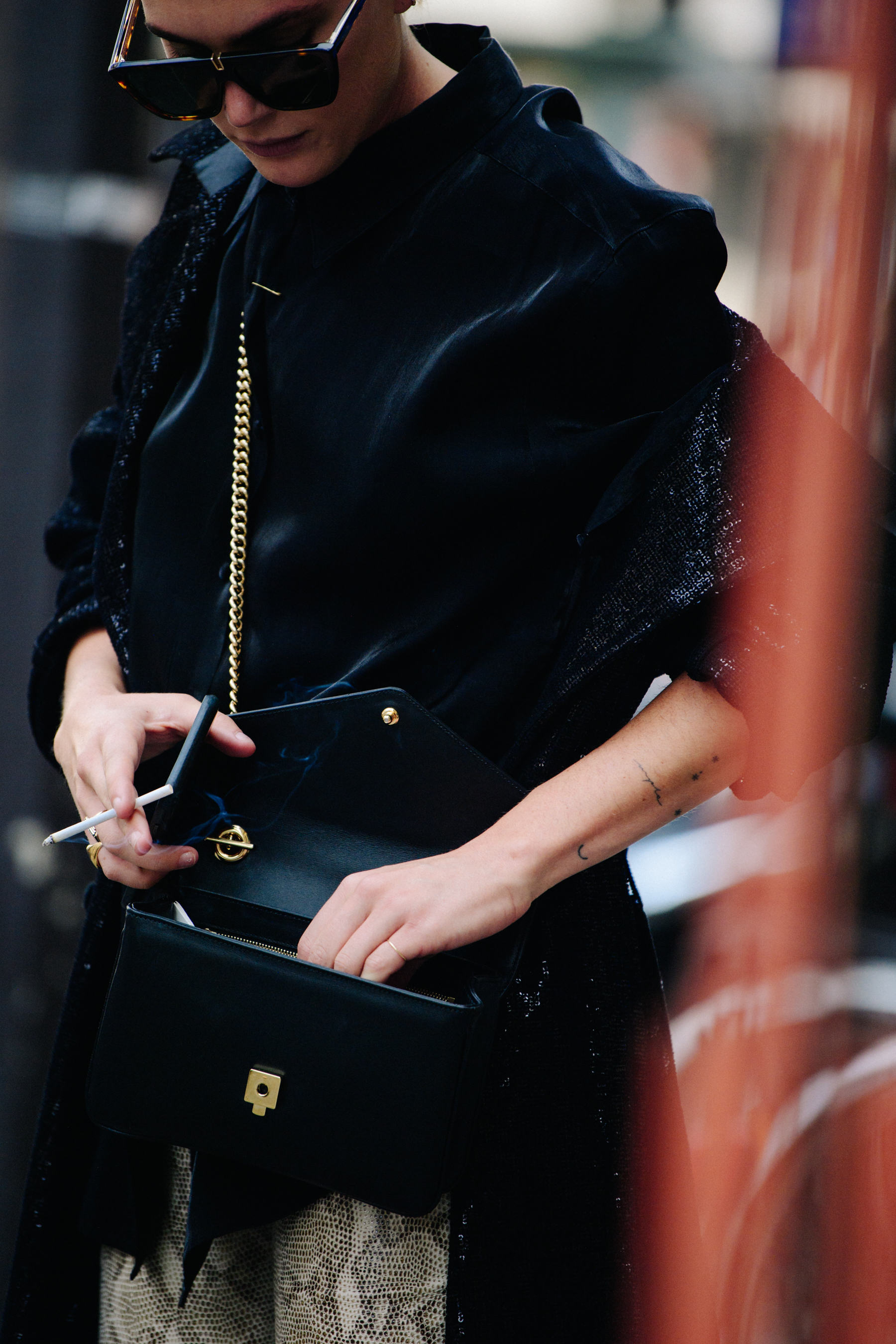 Woman wearing black sequin coat