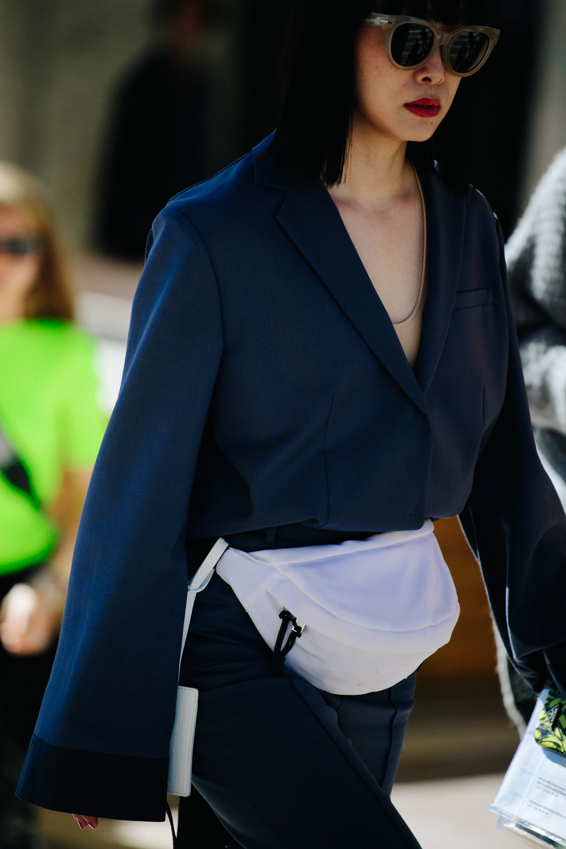 Woman wearing white hip bag