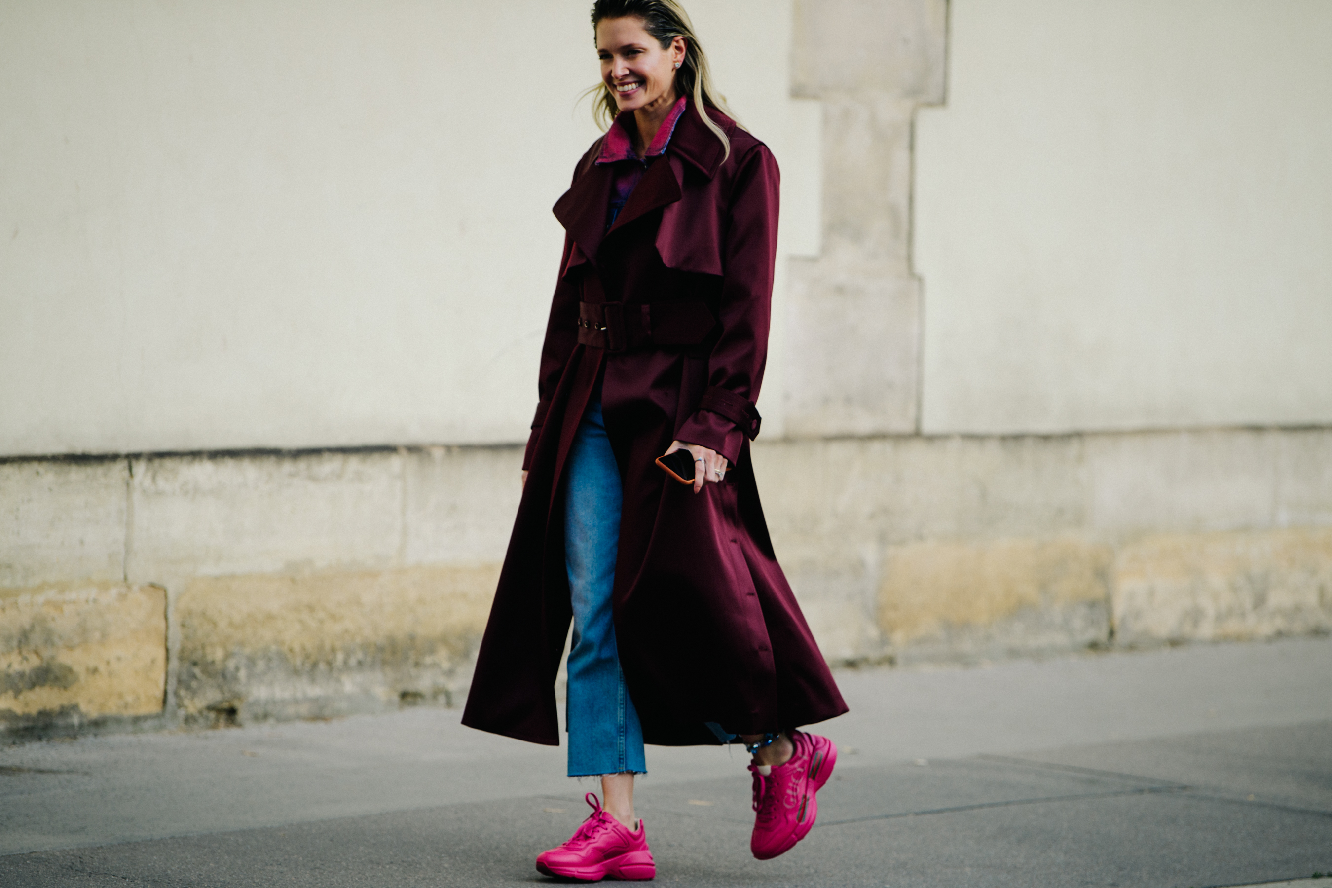 Woman wearing purple trench coat